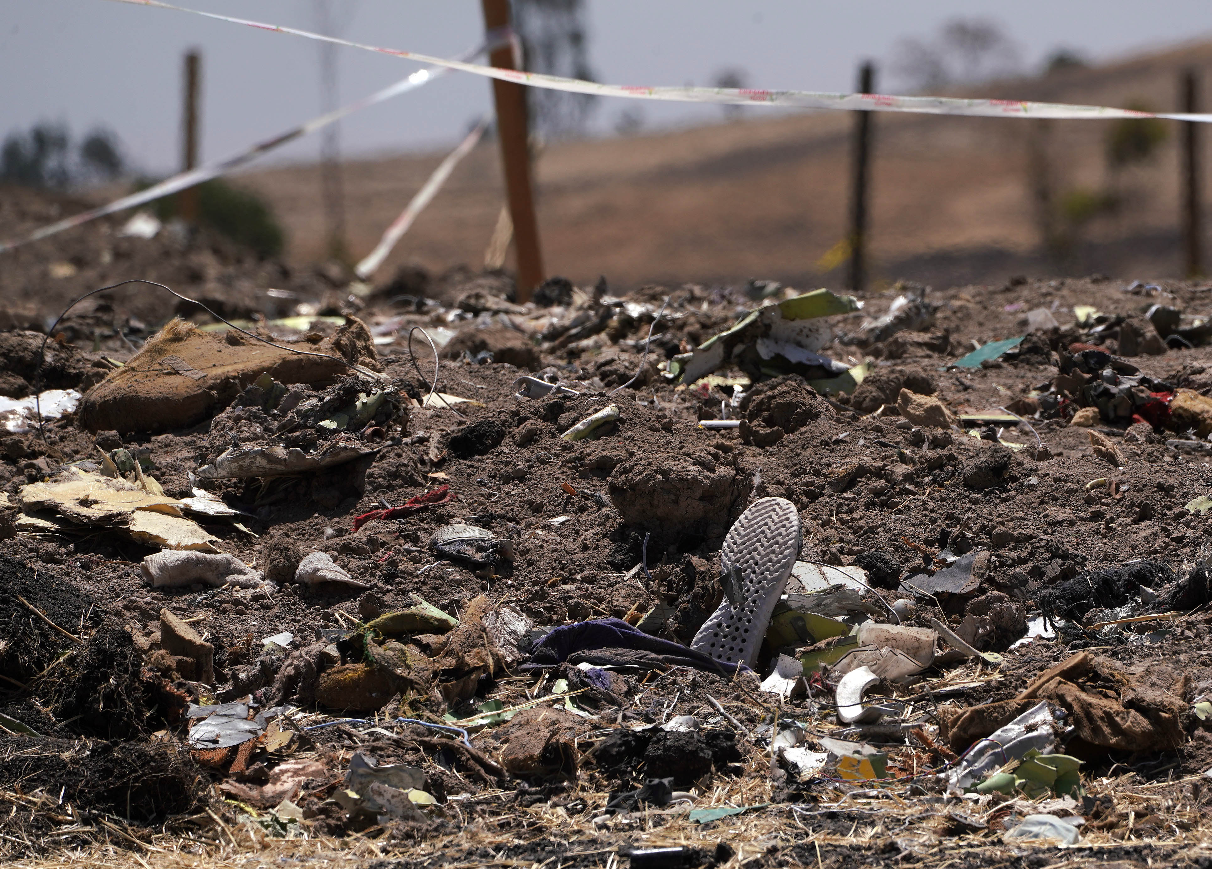 A shoe rests amidst other debris just outside the crater where Ethiopian Airlines flight ET302 crashed on March 10, 2019. (Photo by Jemal Countess/Getty Images)