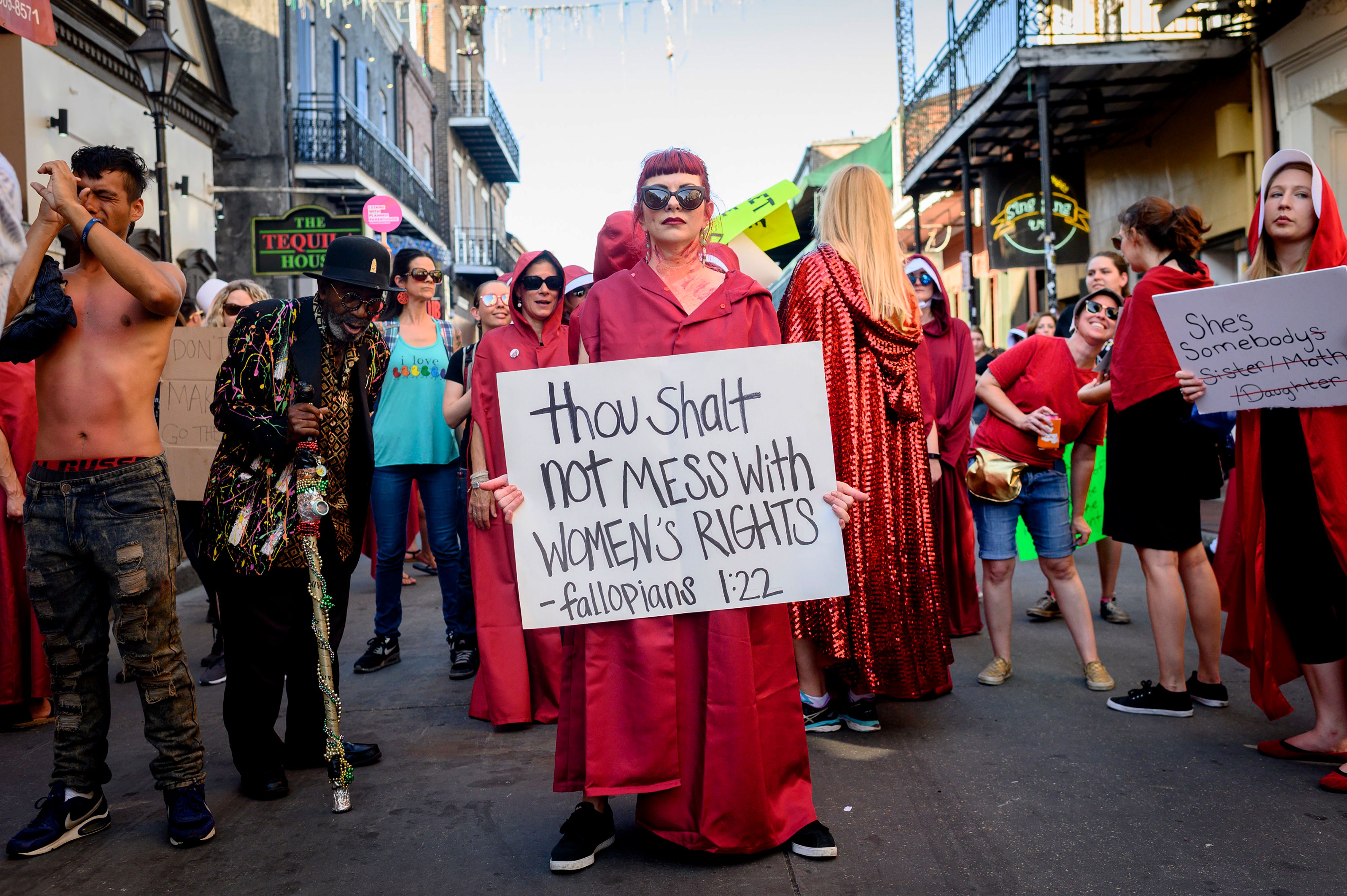 Handsmaid themed protesters march down Bourbon Street in the French Quarter of New Orleans, Louisiana, on May 25, 2019, to protest the proposed Heartbeat Bill that will ban abortion after 6 weeks in that state scheduled for a vote on May 28. (EMILY KASK/AFP/Getty Images)