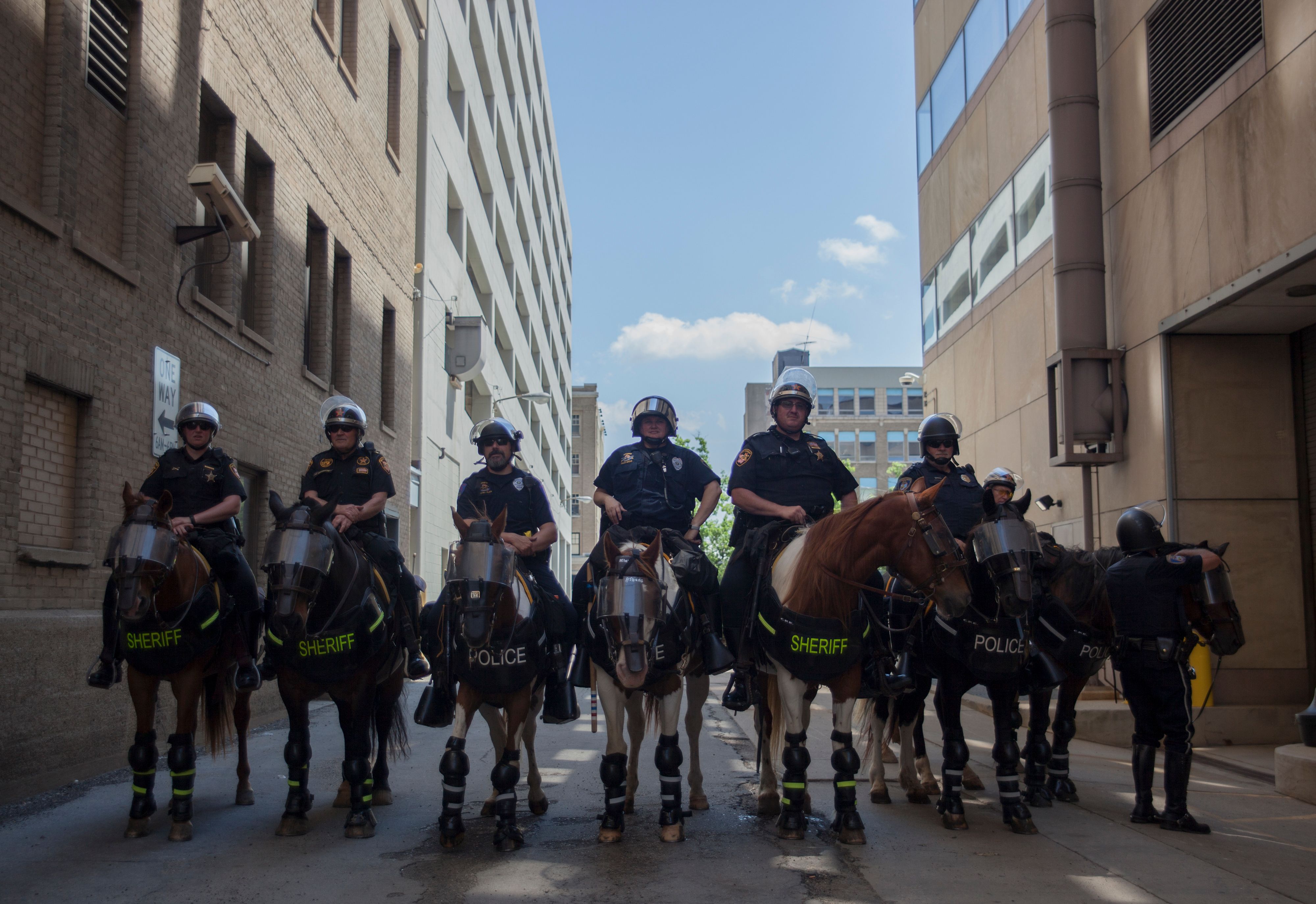 A mounted police unit waits in a staging area as a small group from the KKK-affiliated Honorable Sacred Knights gather for a rally in Dayton, Ohio, May 25, 2019. (SETH HERALD/AFP/Getty Images)