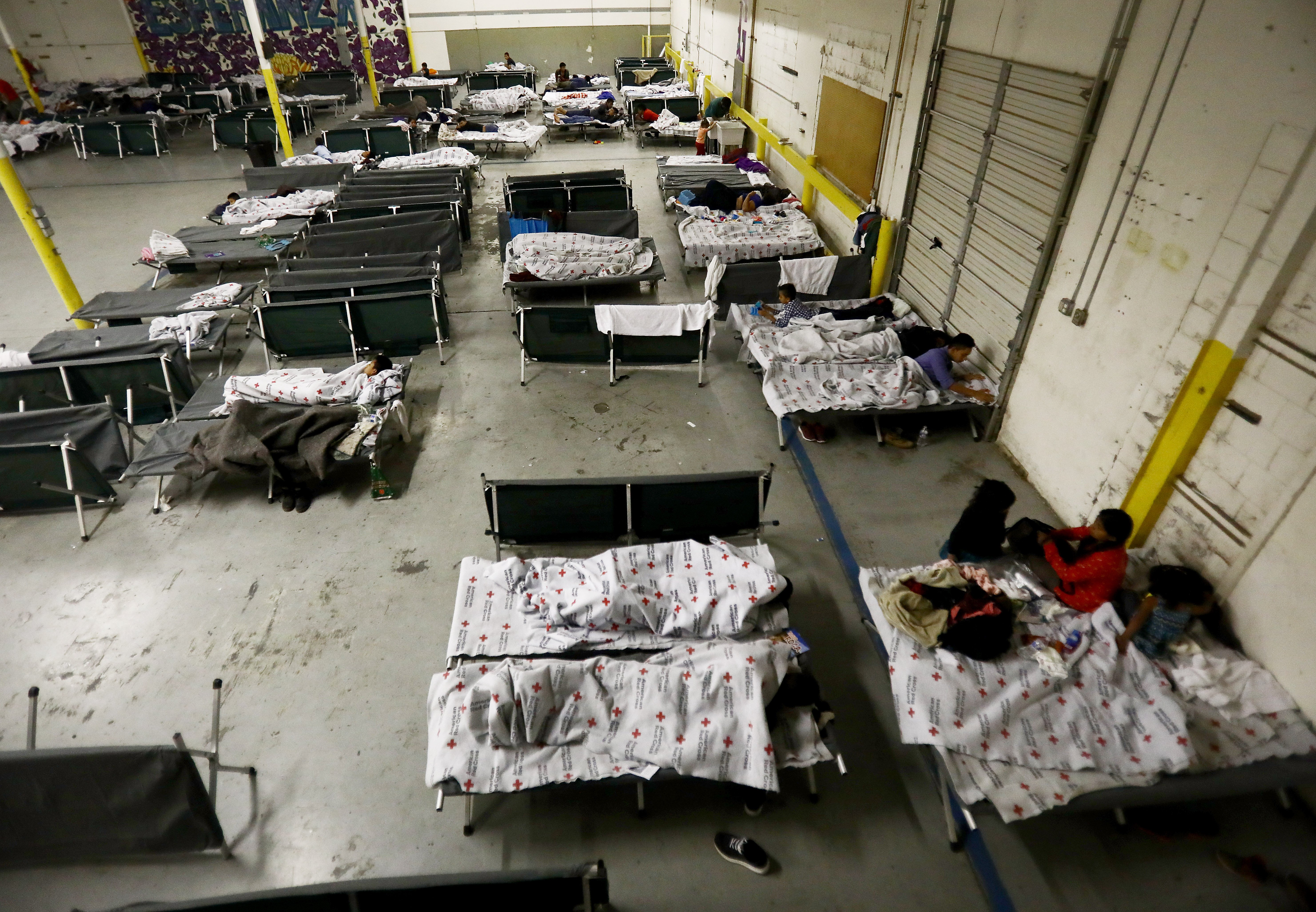 EL PASO, TEXAS - MAY 15: Migrants from Central America gather in the 'House of the Refugee' shelter for migrants, an Annunciation House site, on May 15, 2019 in El Paso, Texas. Annunciation House recently opened the new shelter in a warehouse to keep pace with the recent surge in migrants crossing the border in the El Paso sector. Approximately 1,000 migrants per day are being released by authorities in the El Paso sector of the U.S.-Mexico border. President Trump is expected to present a new immigration plan in a White House Rose Garden speech May 16. (Photo by Mario Tama/Getty Images)