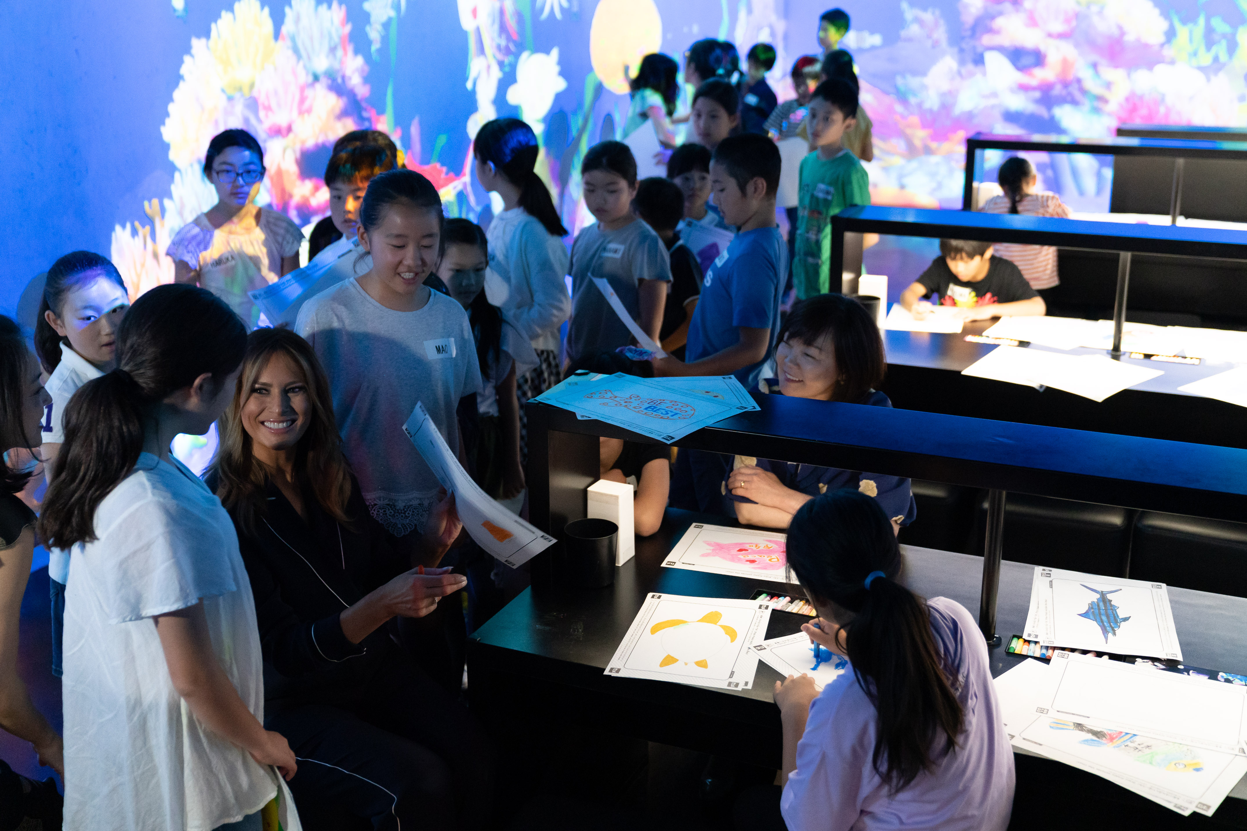 TOKYO, JAPAN - MAY 26: U.S. first Lady Melania Trump (L) and Japan's Prime Minister Shinzo Abe's wife Akie Abe (R) meet primary school students during her visit at the MORI Building DIGITAL ART MUSEUM on May 26, 2019 in Tokyo, Japan. (Photo by Pierre Emmanuel Deletree - Pool/Getty Images)