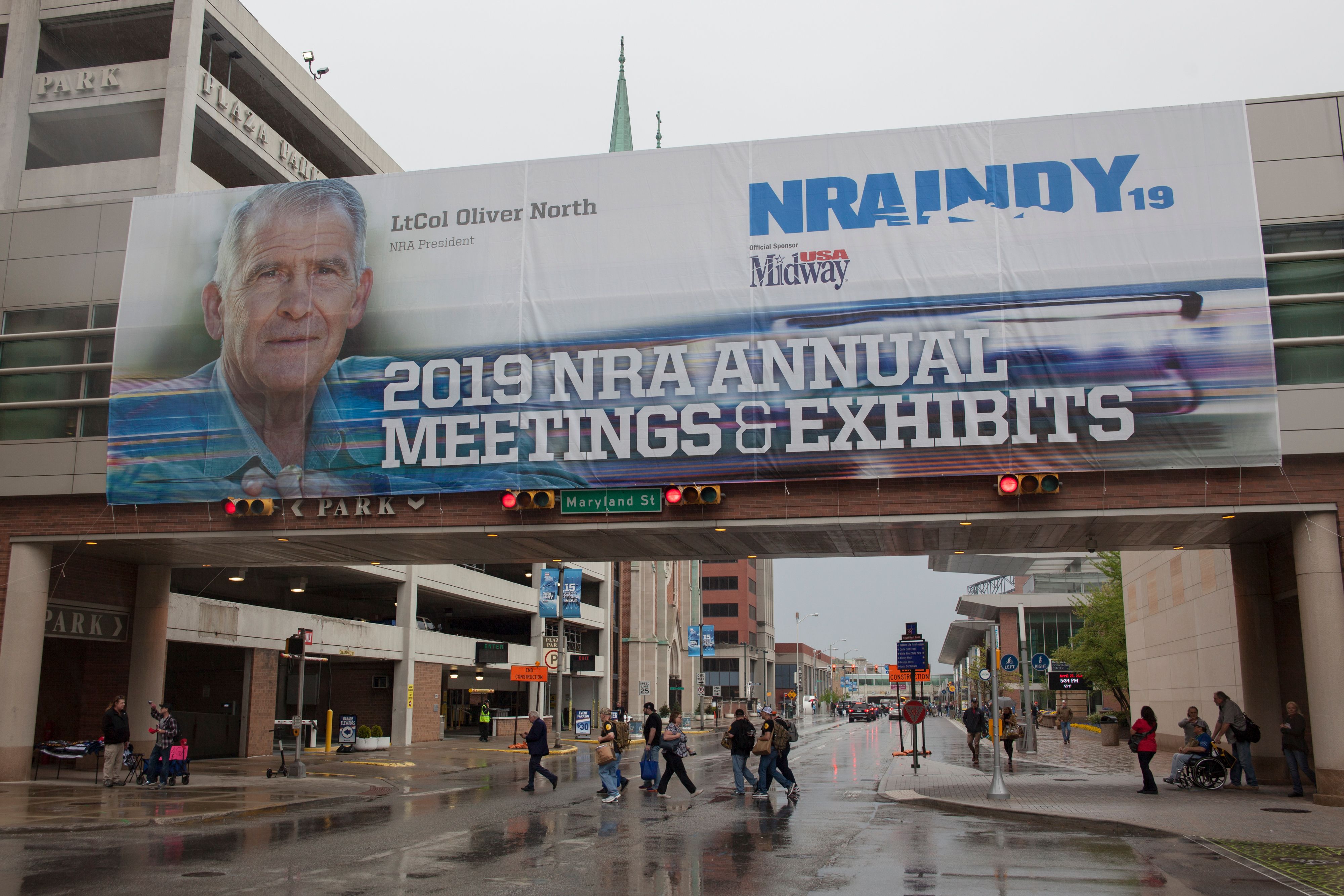 A sign featuring the former President of the National Rifle Association Lt Col. Oliver L. North hangs outside of the Indiana Convention Center in downtown Indianapolis, Indiana, April 27,2019 during the 2019 National Rifle Association Annual Meetings. - After bitter infighting the NRA President announced Saturday, April 27,2019 that he would step down from his position. (Photo by SETH HERALD/AFP/Getty Images)