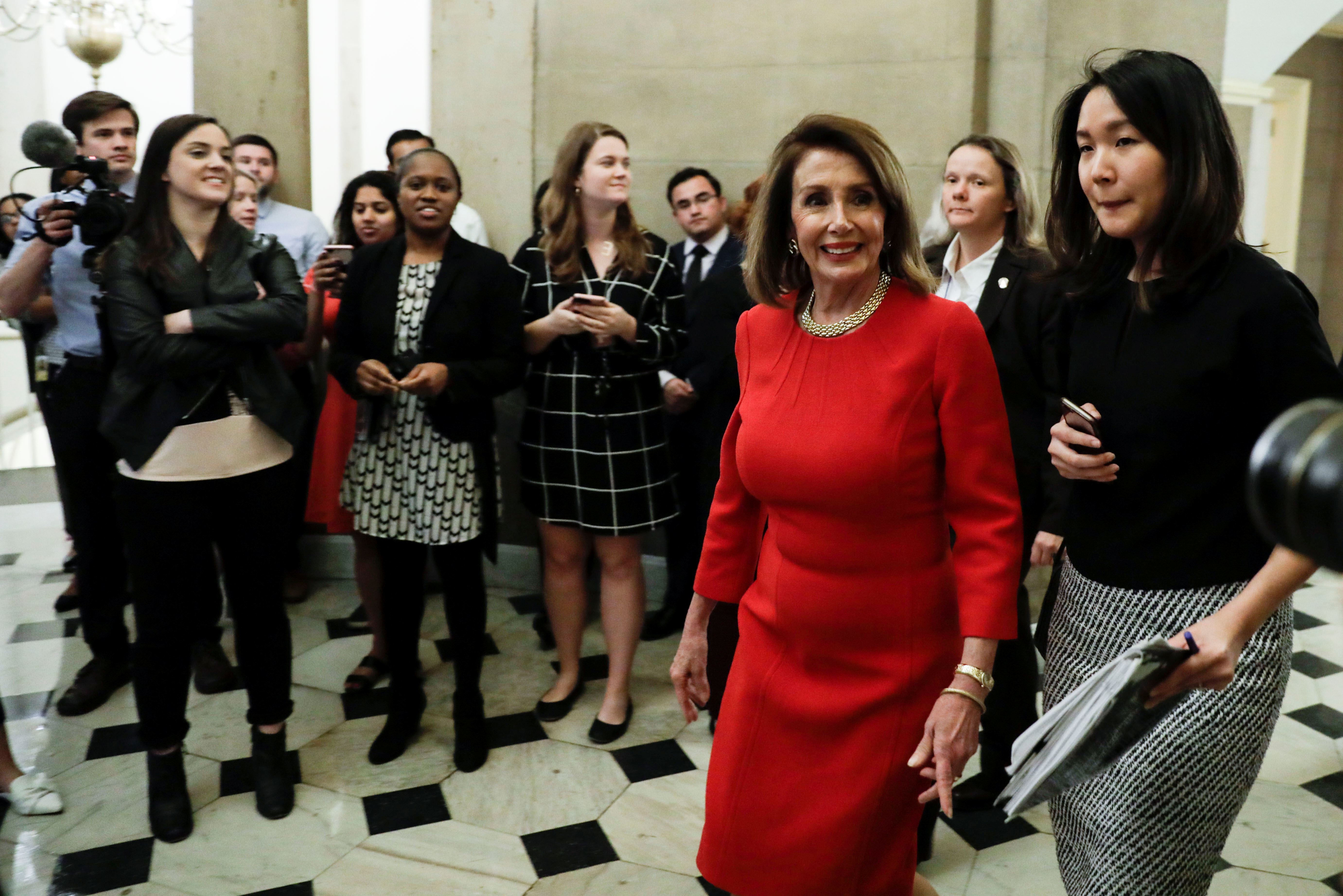 Speaker of the House Pelosi walks through Statuary Hall at the U.S. Capitol in Washington