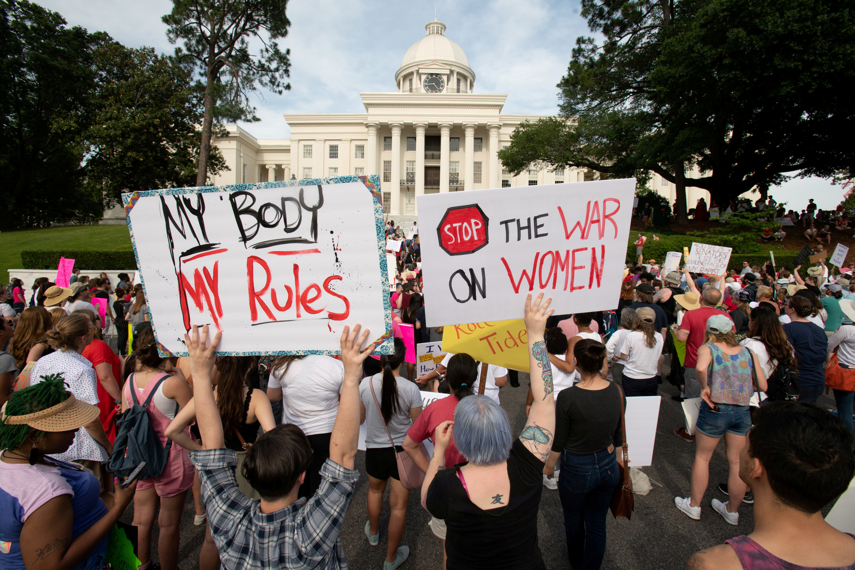 People gather at the Alabama State Capitol during the March for Reproductive Freedom against the state's new abortion law, the Alabama Human Life Protection Act, in Montgomery, Alabama, U.S. May 19, 2019. REUTERS/Michael Spooneybarger