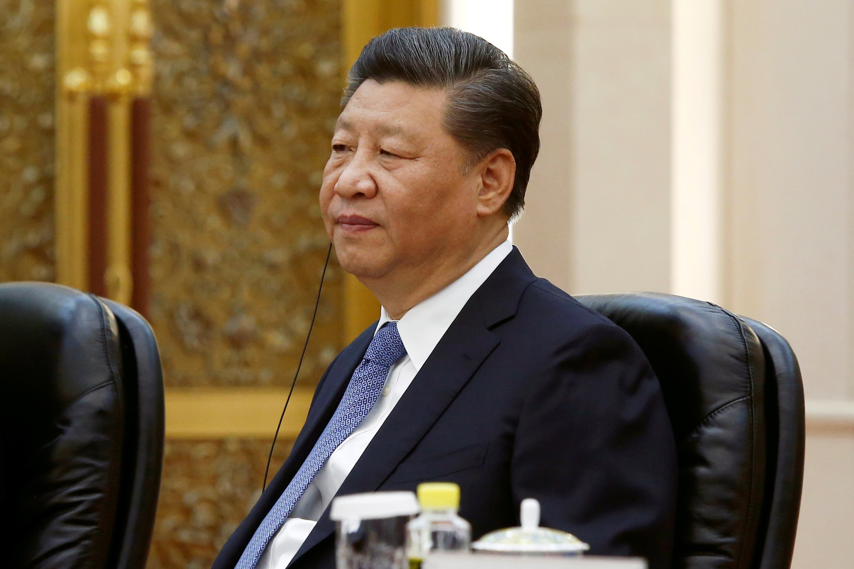 Chinese President Xi Jinping attends a meeting at the Great Hall of the People in Beijing