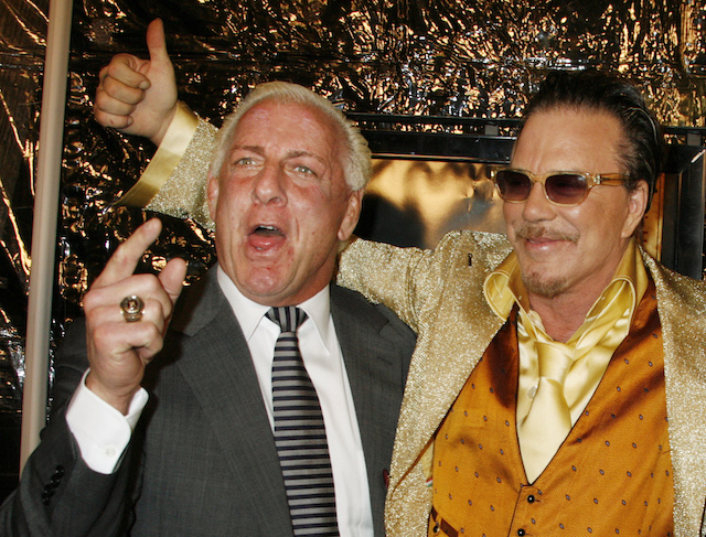 Actor Mickey Rourke (R), star of the film "The Wrestler," poses with retired professional wrestler Ric Flair at the film's Los Angeles premiere in Beverly Hills, California, December 16, 2008. REUTERS/Fred Prouser