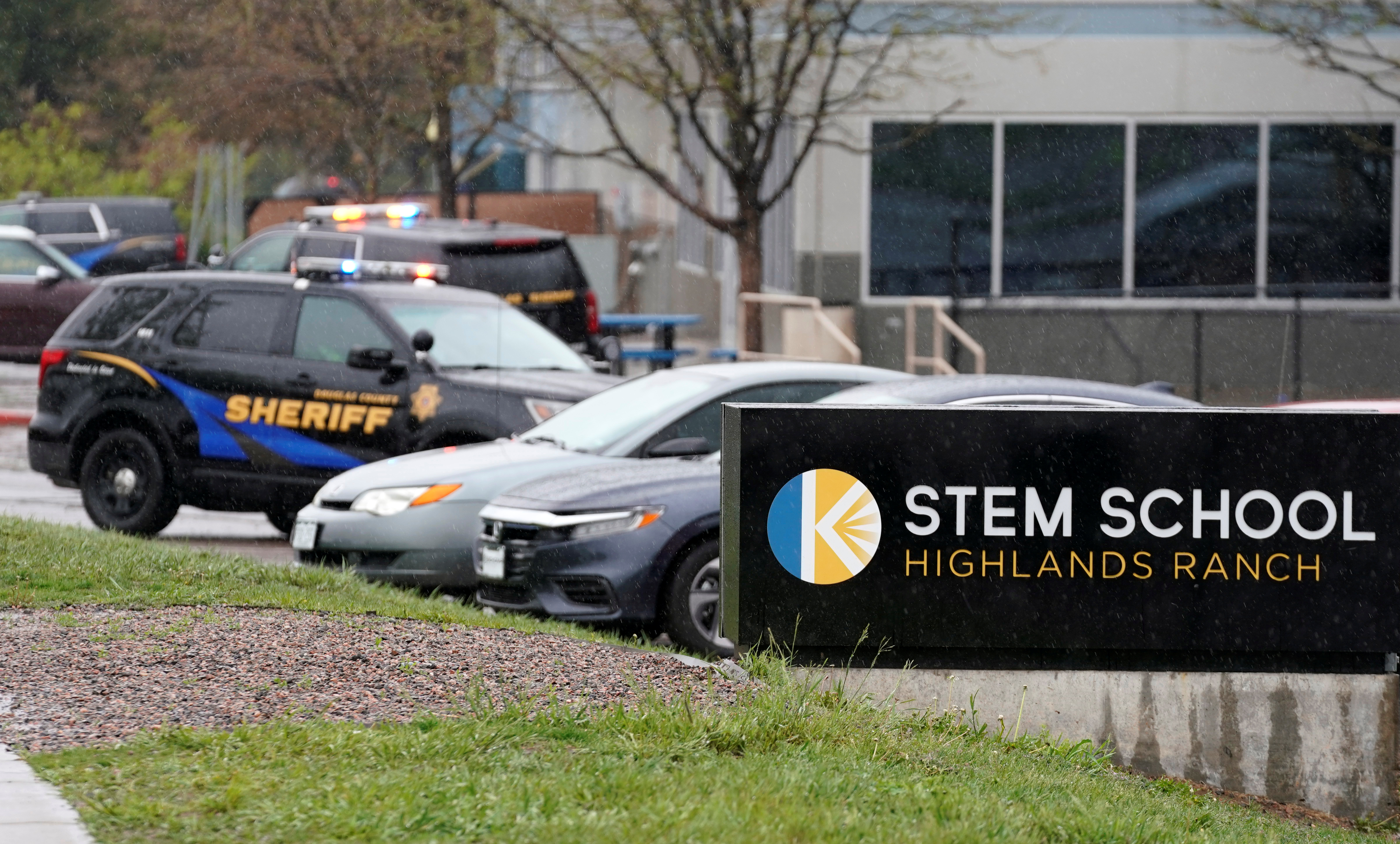 Police vehicles are stationed outside the school following the shooting at the Science, Technology, Engineering and Math (STEM) School in Highlands Ranch, Colorado, U.S., May 8, 2019. REUTERS/Rick Wilking