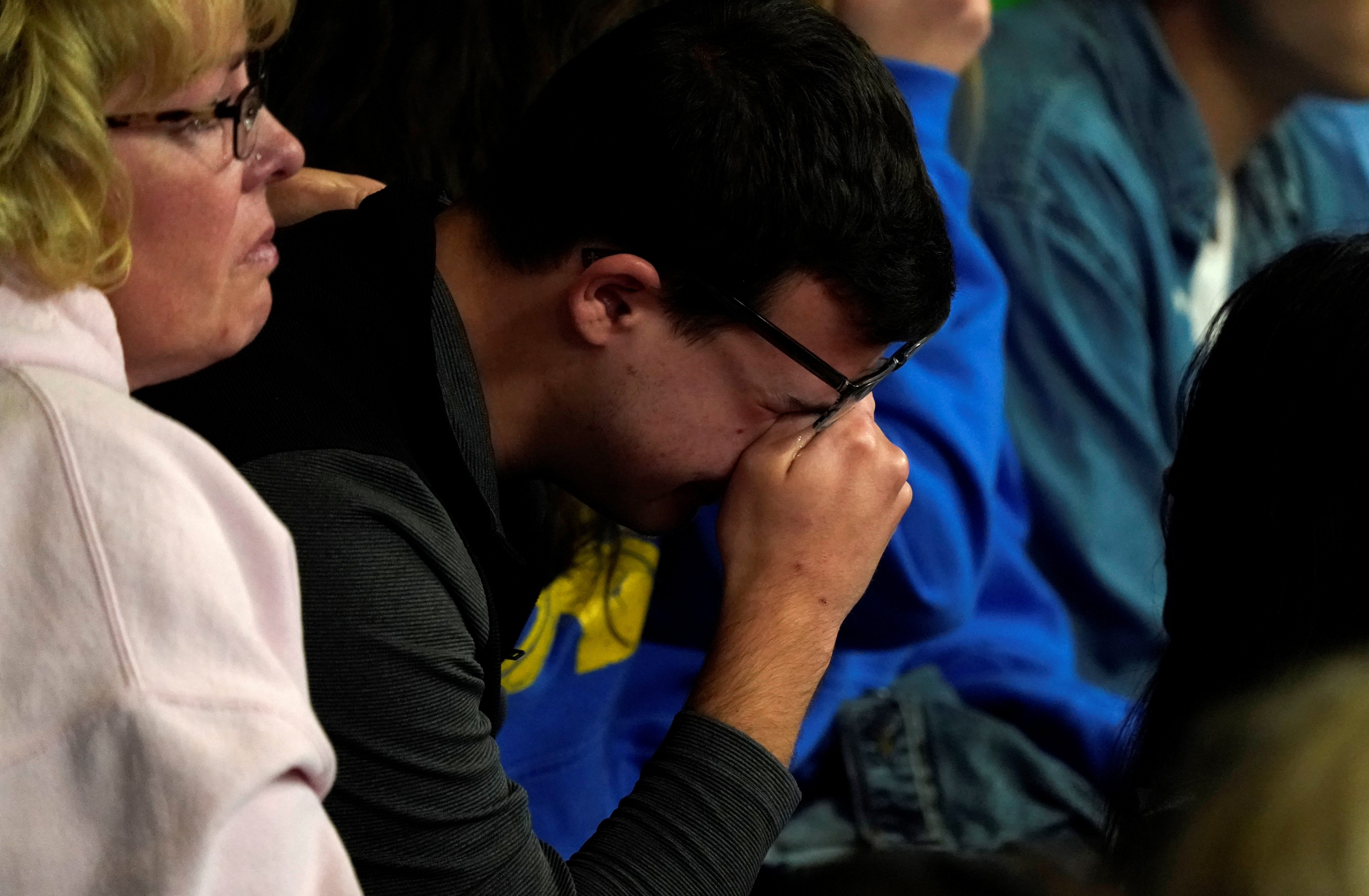 A man cries at a vigil for the victims of the shooting at the Science, Technology, Engineering and Math (STEM) School in Highlands Ranch, Colorado, U.S., May 8, 2019. REUTERS/Rick Wilking 