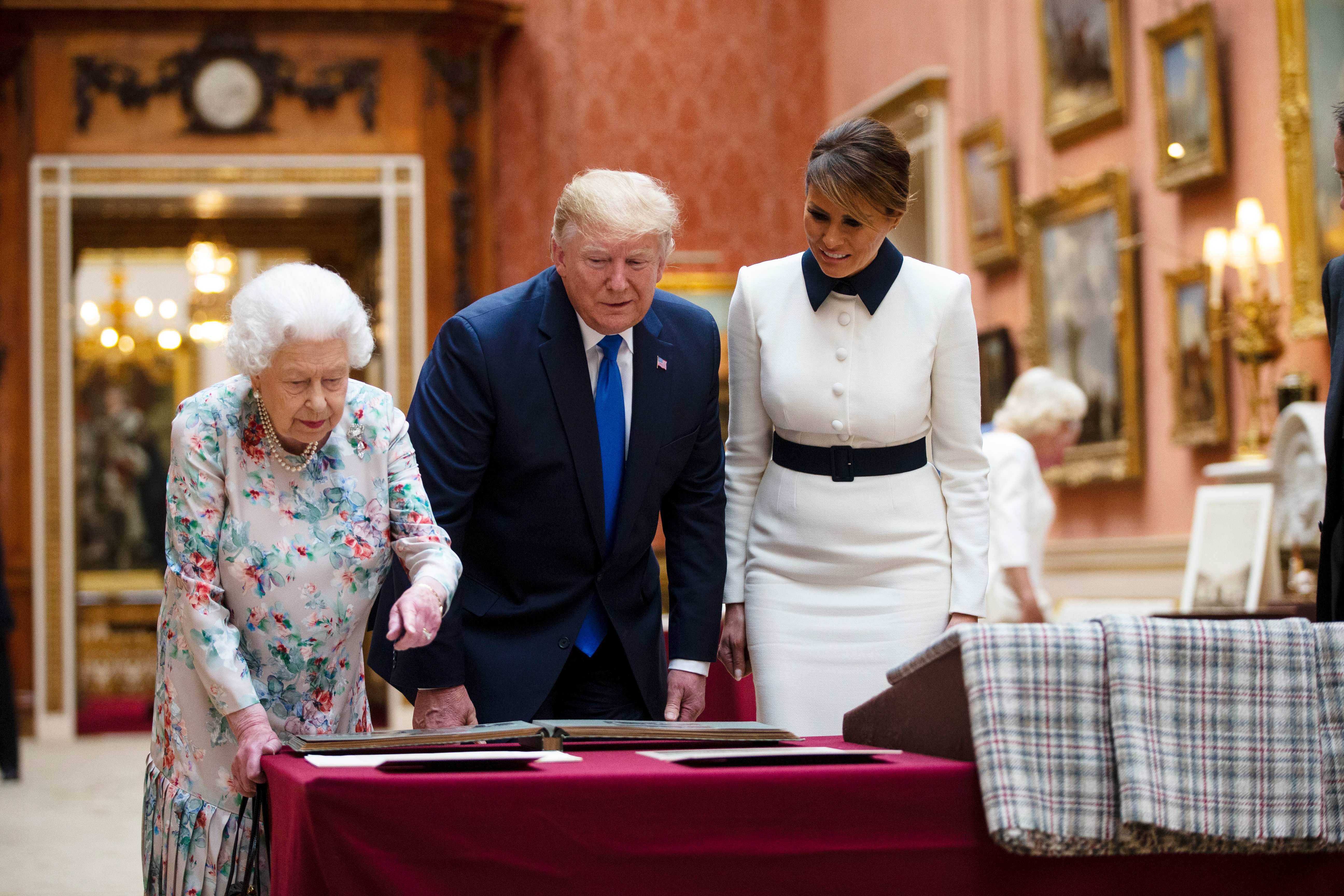 Queen Elizabeth II, US President Donald Trump and First Lady Melania Trump view American items in the Royal collection at Buckingham Palace on June 3, 2019 in London, England. (Ian Vogler - WPA Pool/Getty Images)
