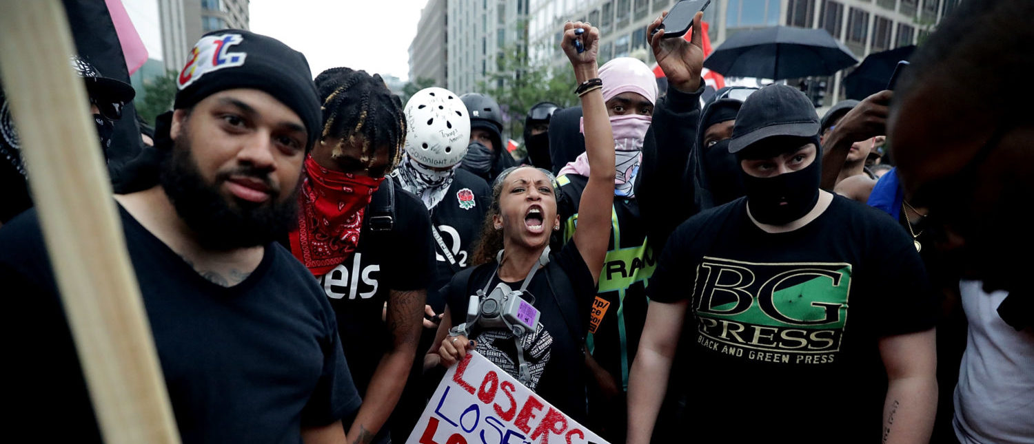 Counter protesters and members of the Antifa and Blac Bloc rally on the east side of the Eisenhower Executive Office Building as the white supremacist Unite the Right rally is being held across from the White House August 12, 2018 in Washington, DC. (Chip Somodevilla/Getty Images)