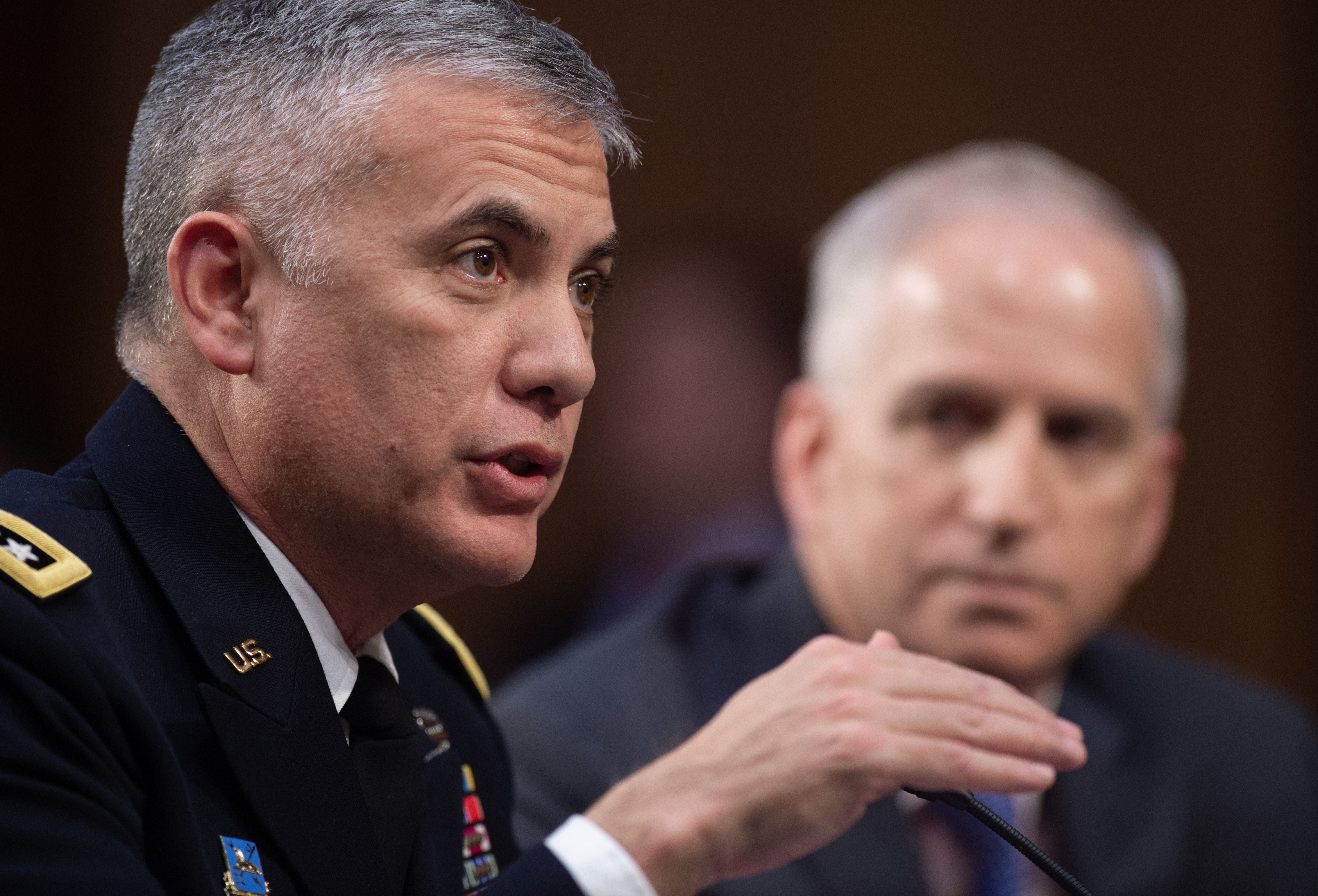 General Paul Nakasone (L), director of the National Security Agency, and Robert Cardillo (R), director of the National Geospatial-Intelligence Agency, testify on Worldwide Threats (SAUL LOEB/AFP/Getty Images)