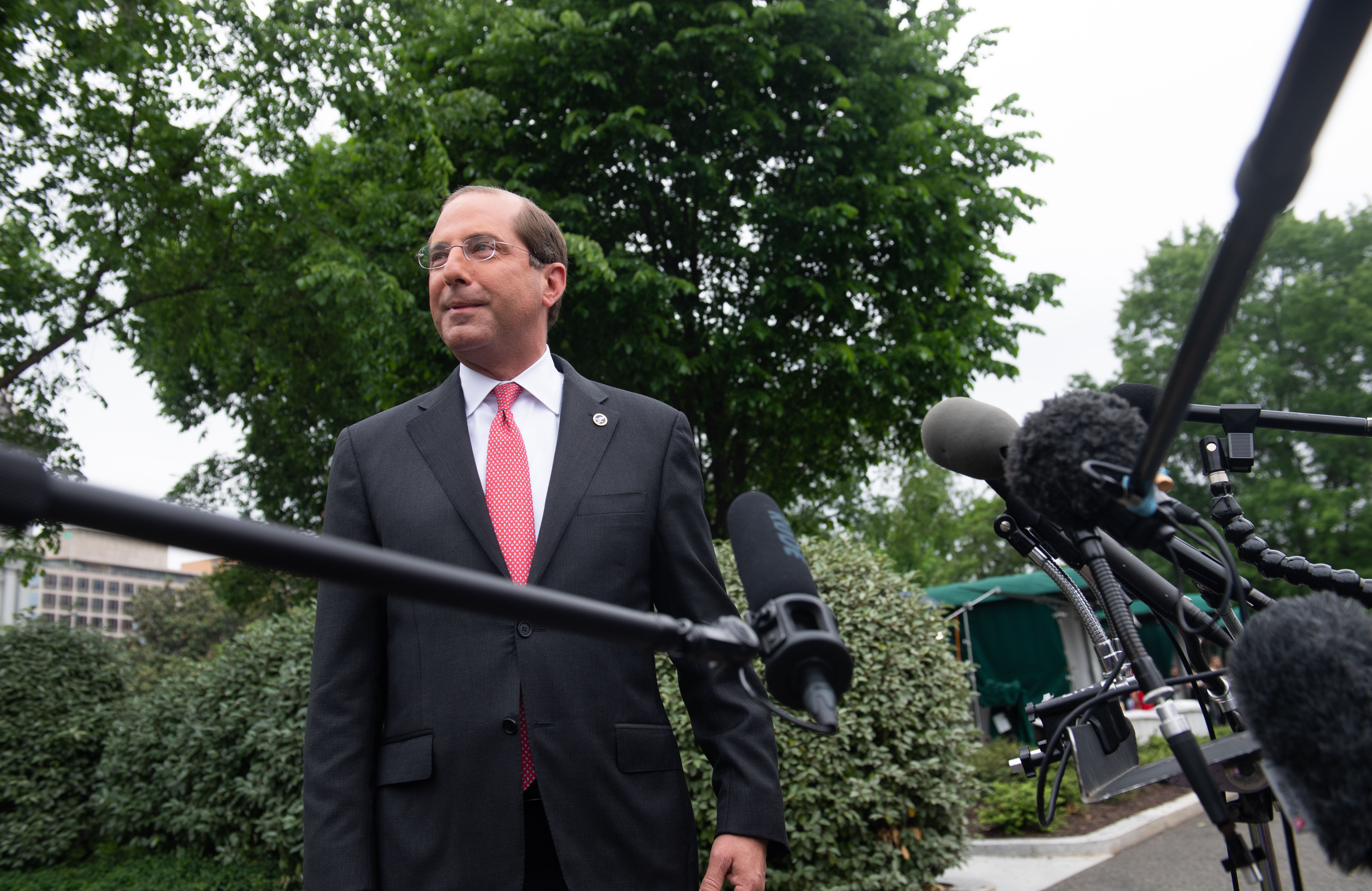 Alex Azar, Secretary of Health and Human Services, speaks to the press in the driveway of the White House in Washington, DC, May 8, 2019. (Photo by SAUL LOEB/AFP/Getty Images)