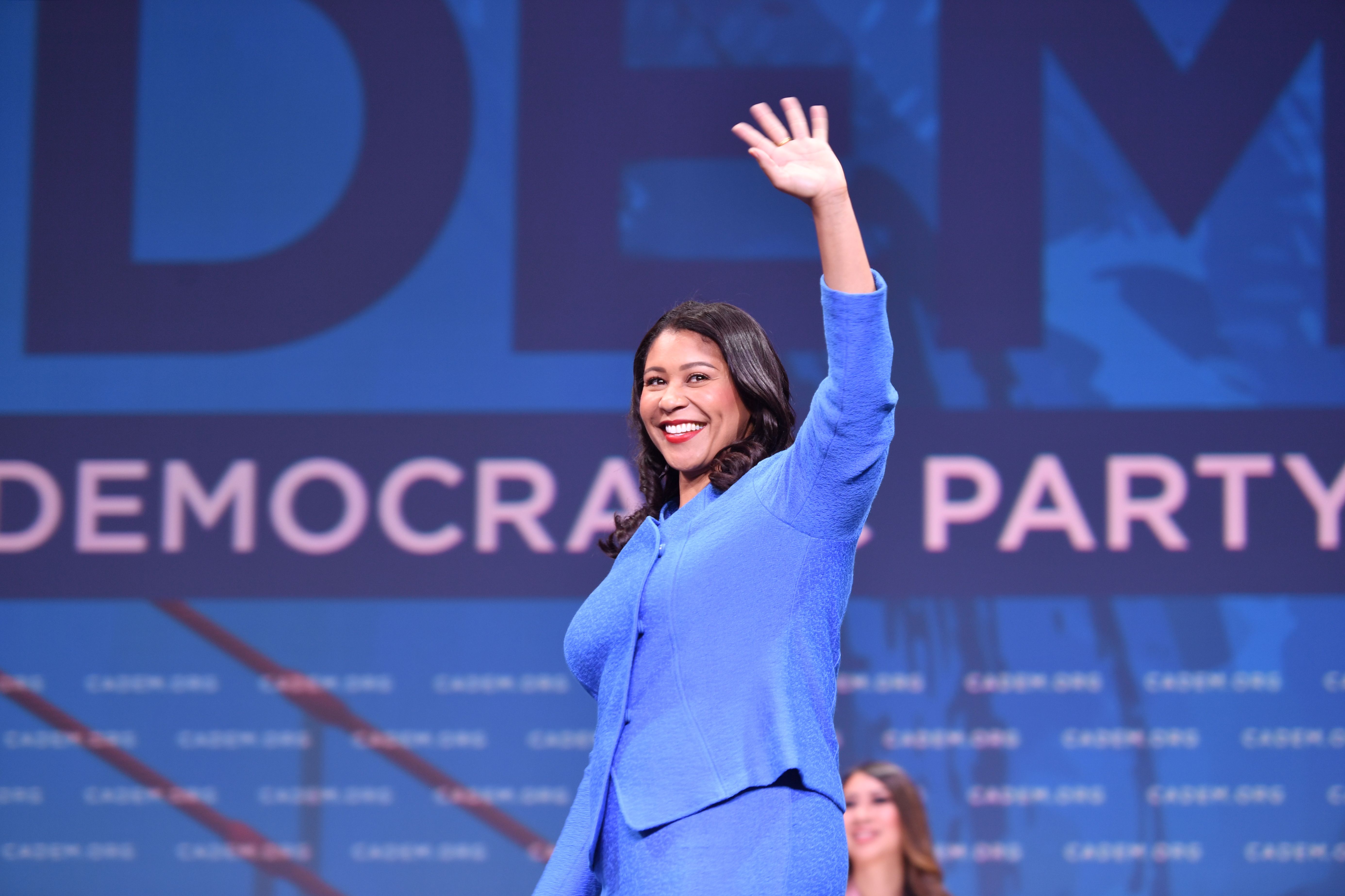 Mayor of San Francisco London Breed waves as she takes the stage during the 2019 California Democratic Party State Convention at Moscone Center in San Francisco on June 1, 2019. (JOSH EDELSON/AFP/Getty Images)