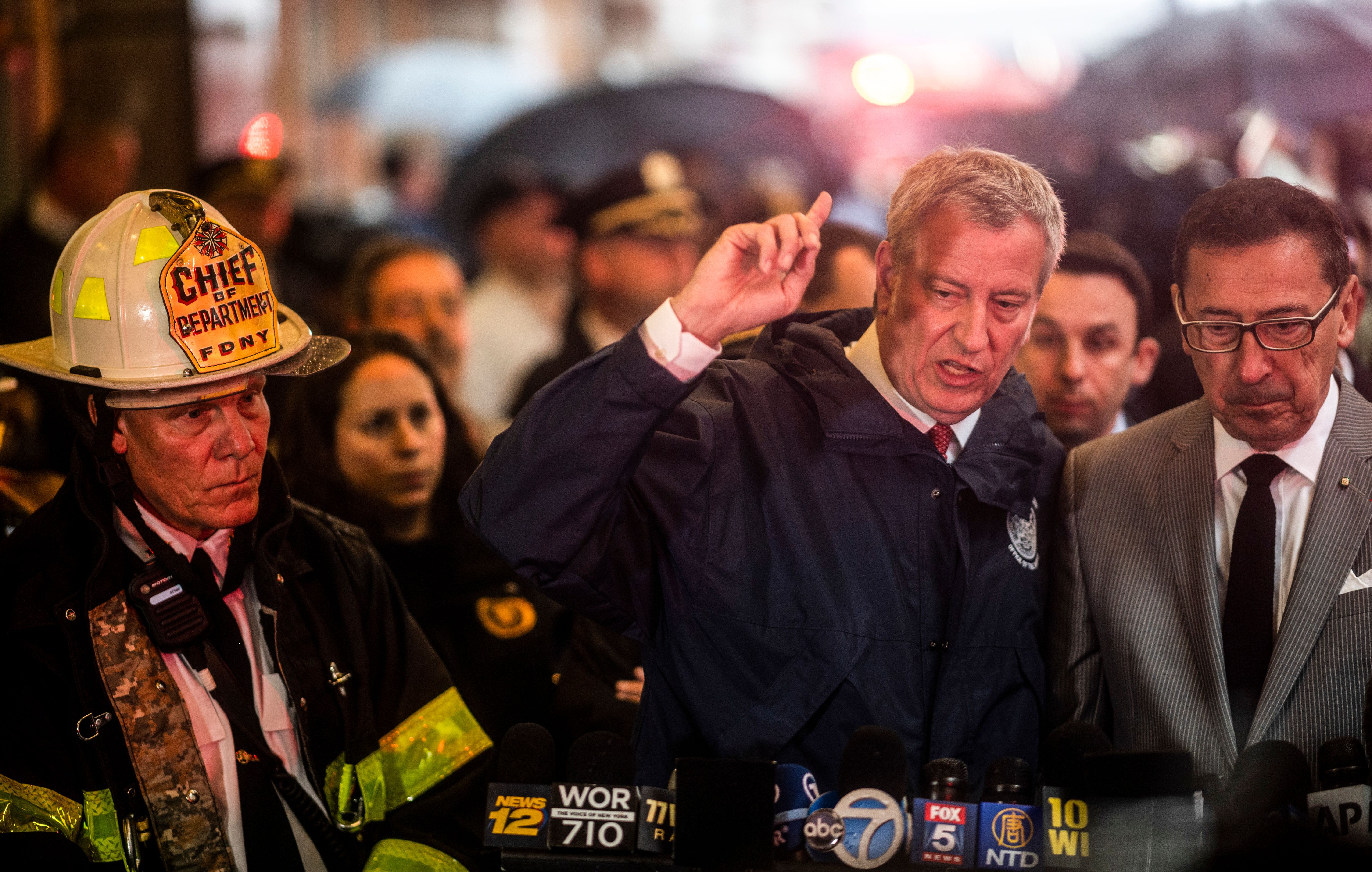 New York City mayor Bill de Blasio (C) addresses the media after a helicopter crash-landed on top of a high-rise in midtown Manhattan in New York on June 10, 2019. (JOHANNES EISELE/AFP/Getty Images)