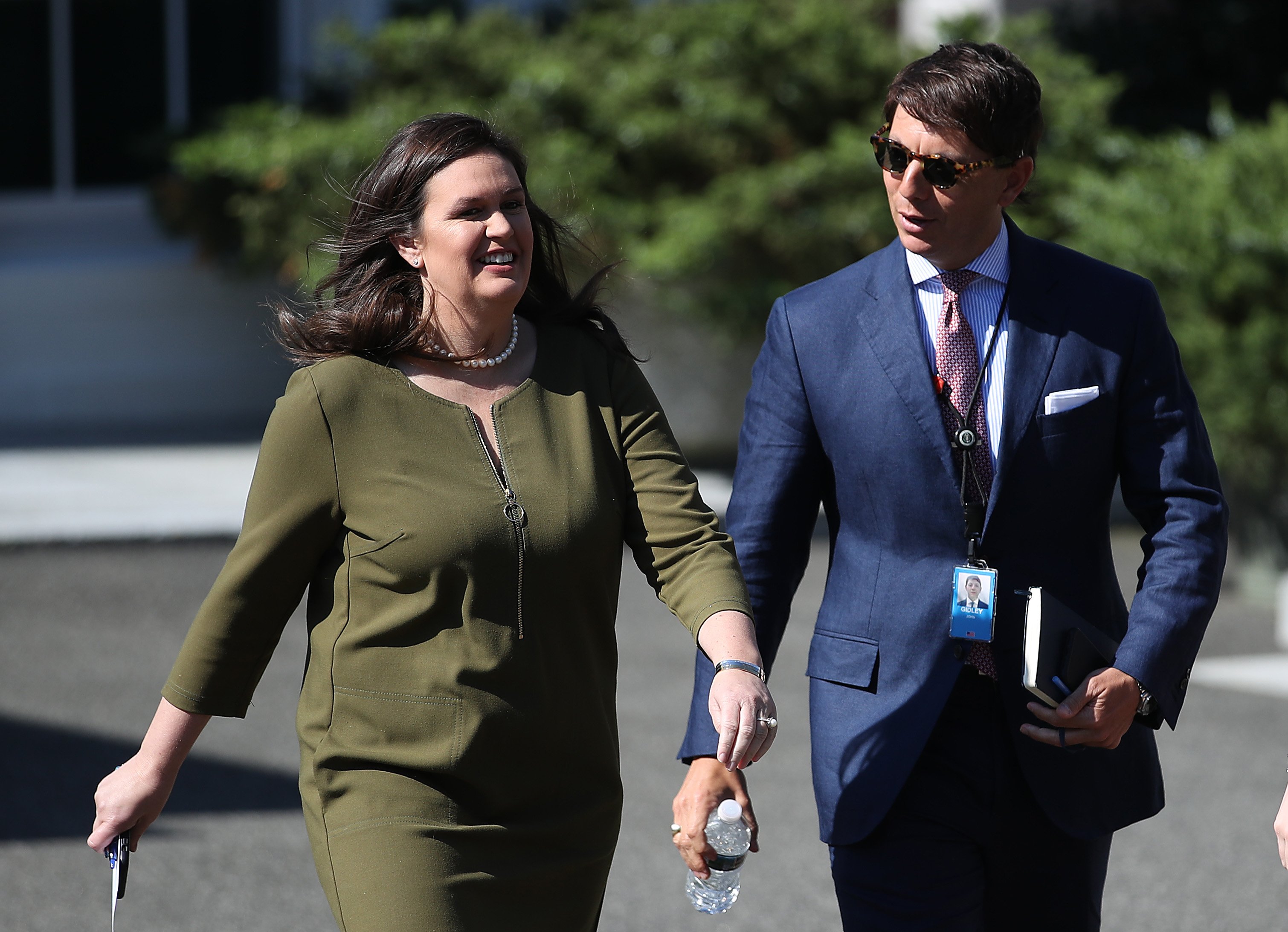 WASHINGTON, DC - MAY 31: White House press secretary Sarah Sanders walks with deputy press secretary Hogan Gidley at the White House May 31, 2019 in Washington, DC. Sanders responded to questions this morning about potential tariffs with Mexico announced by U.S. President Donald Trump last night via Twitter. (Photo by Win McNamee/Getty Images)