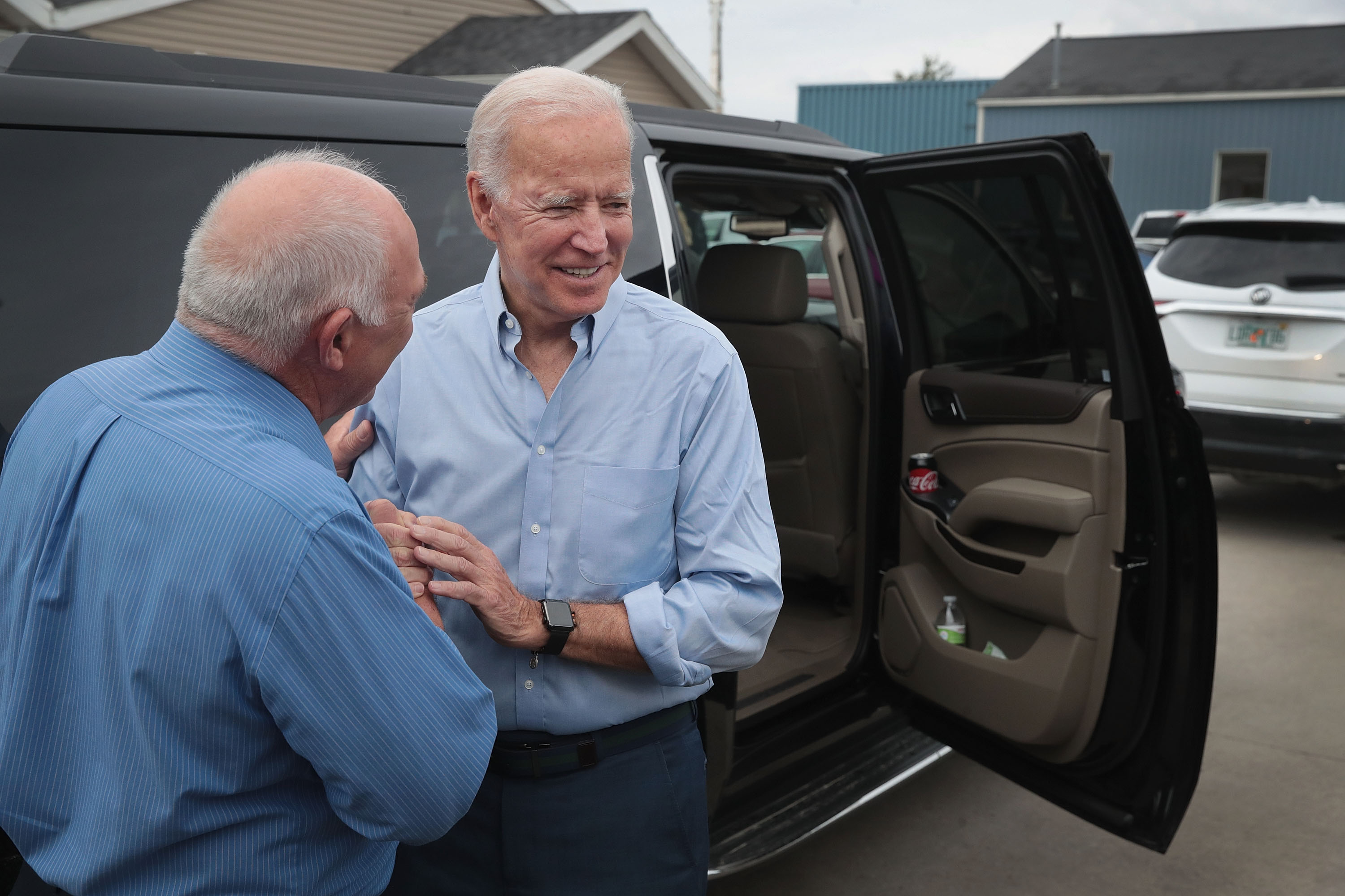 ELDRIDGE, IOWA - JUNE 12: Democratic presidential candidate and former U.S. vice president Joe Biden chats with Mayor Marty O'Boyle outside of the Tasty Cafe following a quick campaign stop at the restaurant on June 12, 2019 in Eldridge, Iowa. The stop was part of a two-day visit to campaign in the state. (Photo by Scott Olson/Getty Images)