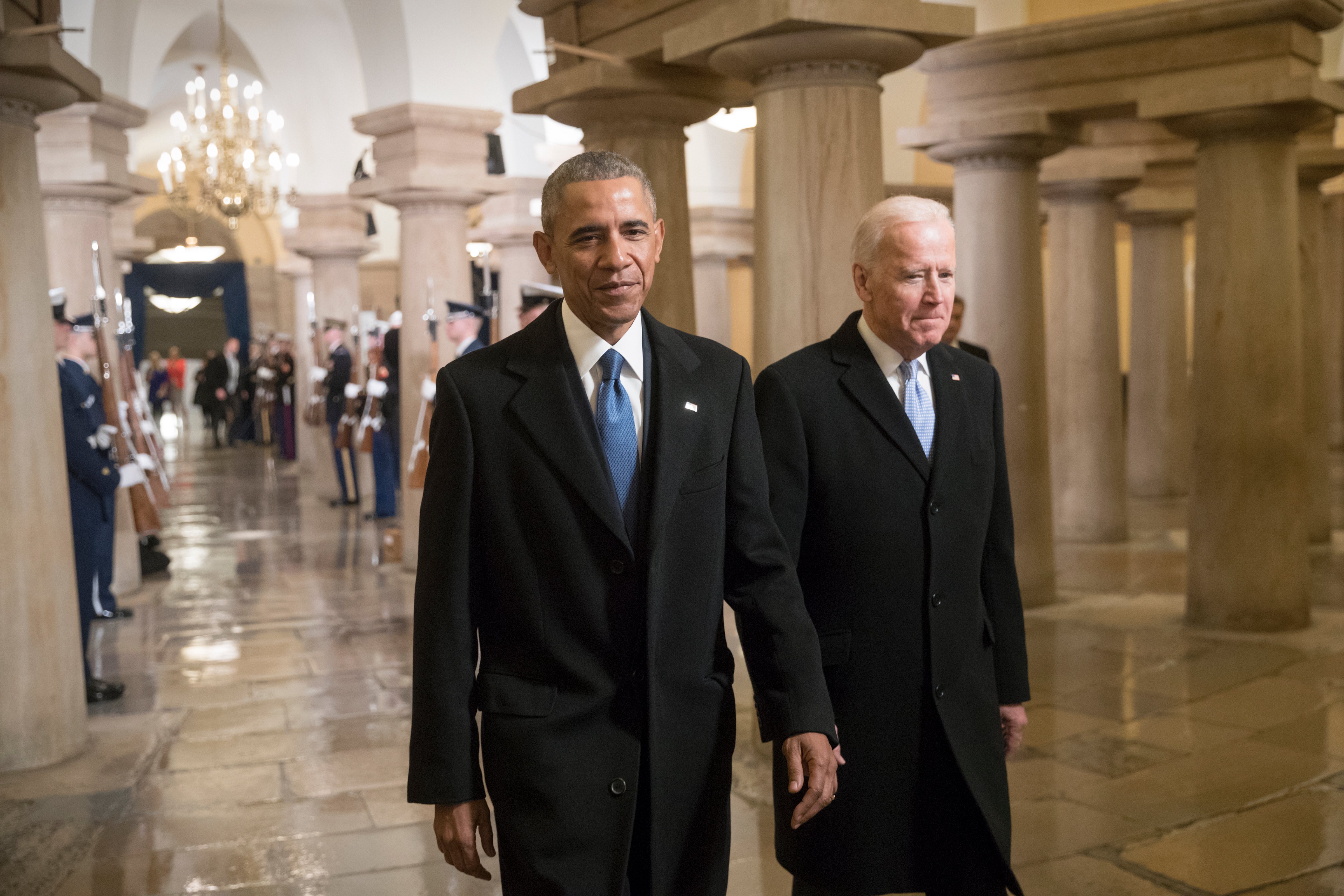 President Barack Obama and Vice President Joe Biden walk through the Crypt of the Capitol for Donald Trump's inauguration ceremony, in Washington, January 20, 2017. (Photo by J. Scott Applewhite - Pool/Getty Images)