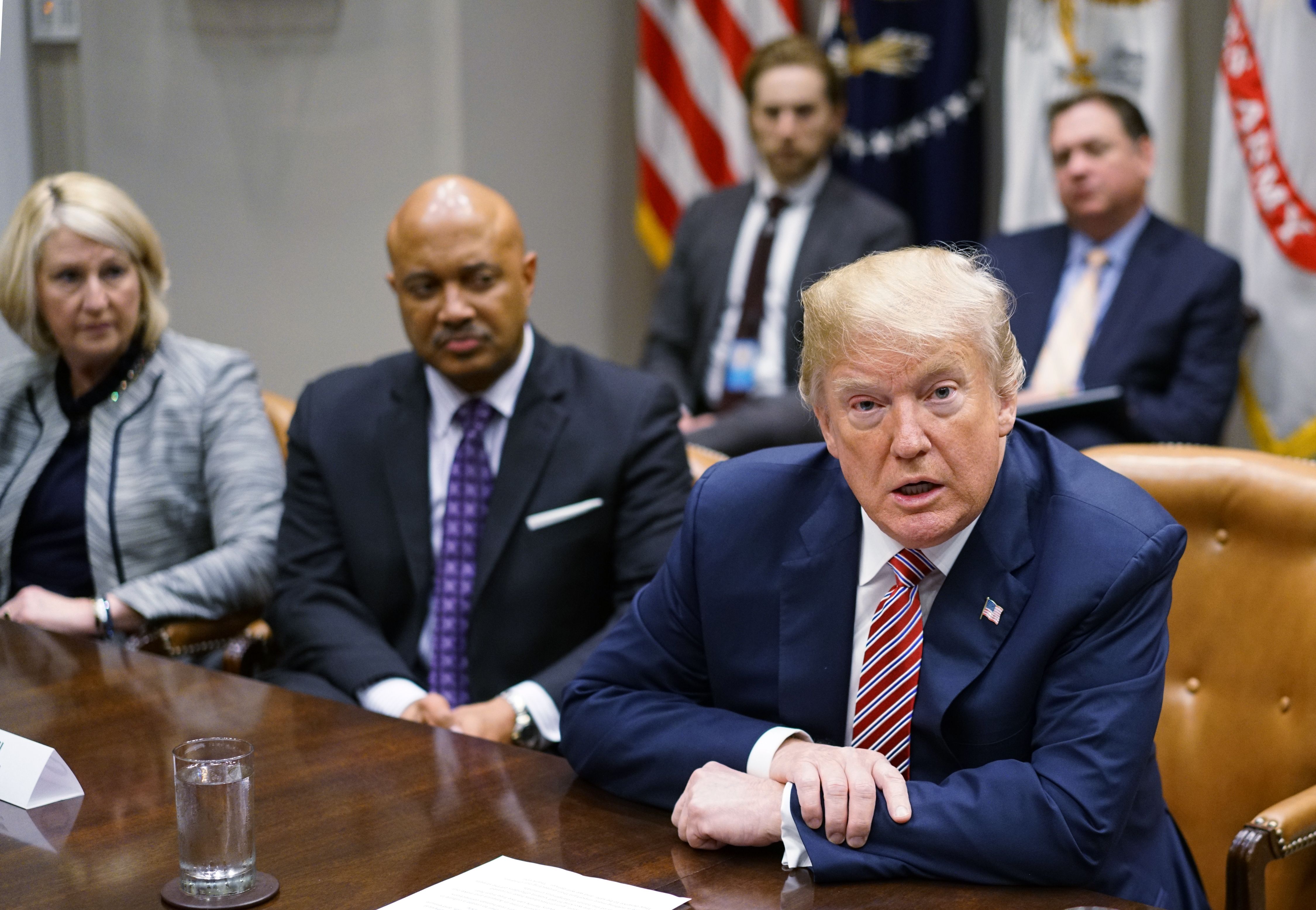 US President Donald Trump speaks during a meeting with state and local officials on school safety in the Roosevelt Room of the White House on February 22, 2018 in Washington, DC. From left are Florida Education Department Commissioner Pam Stewart, and Indiana Attorney General Curtis Hill. / AFP PHOTO / MANDEL NGAN (Photo credit should read MANDEL NGAN/AFP/Getty Images)