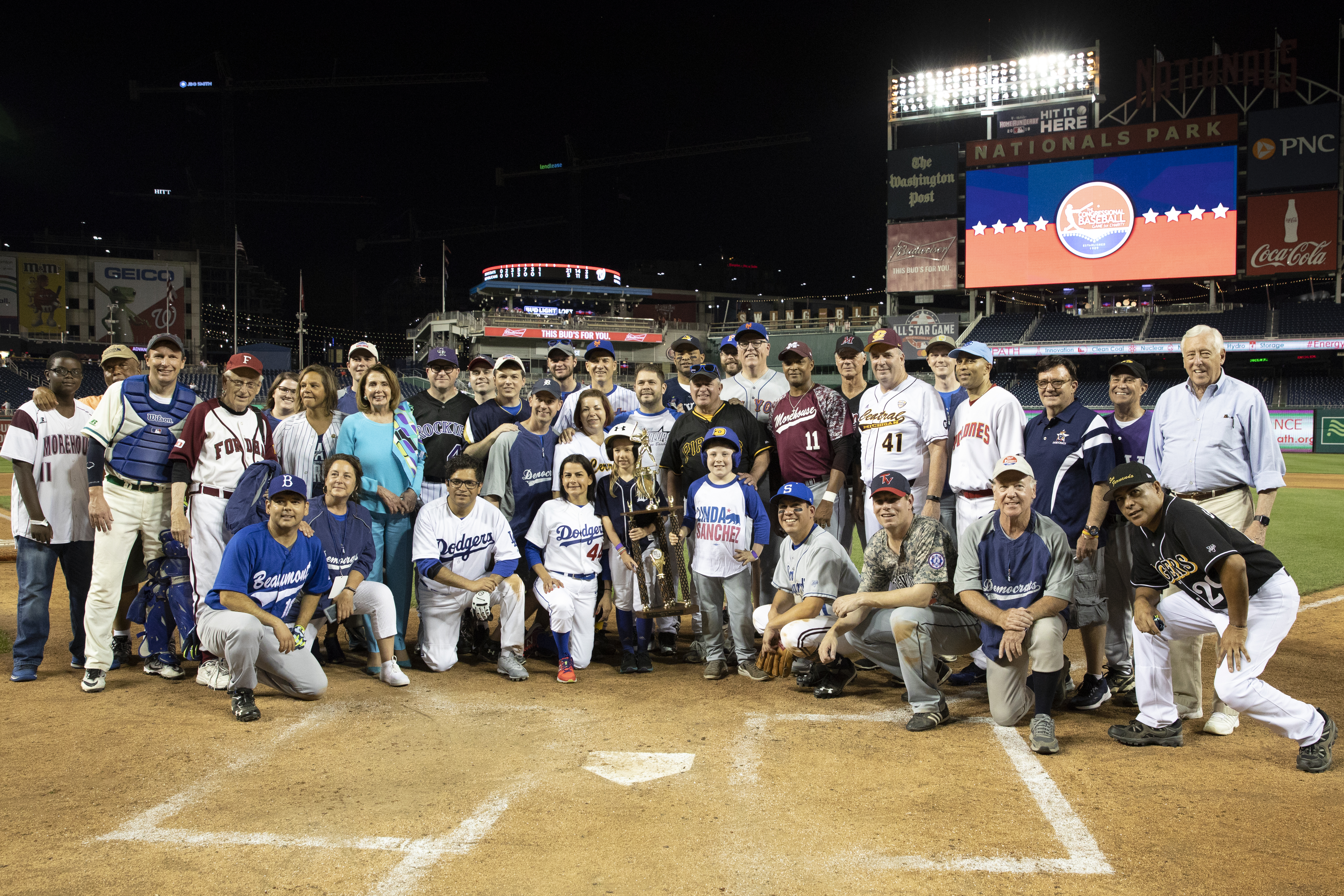 The Democrats pose with the Roll Call Trophy after beating the Republicans 21-5 in the Congressional Baseball Game on June 14, 2018 in Washington, DC. This is the 57th annual game between the Republicans and Democrats. (Photo by Alex Edelman/Getty Images)