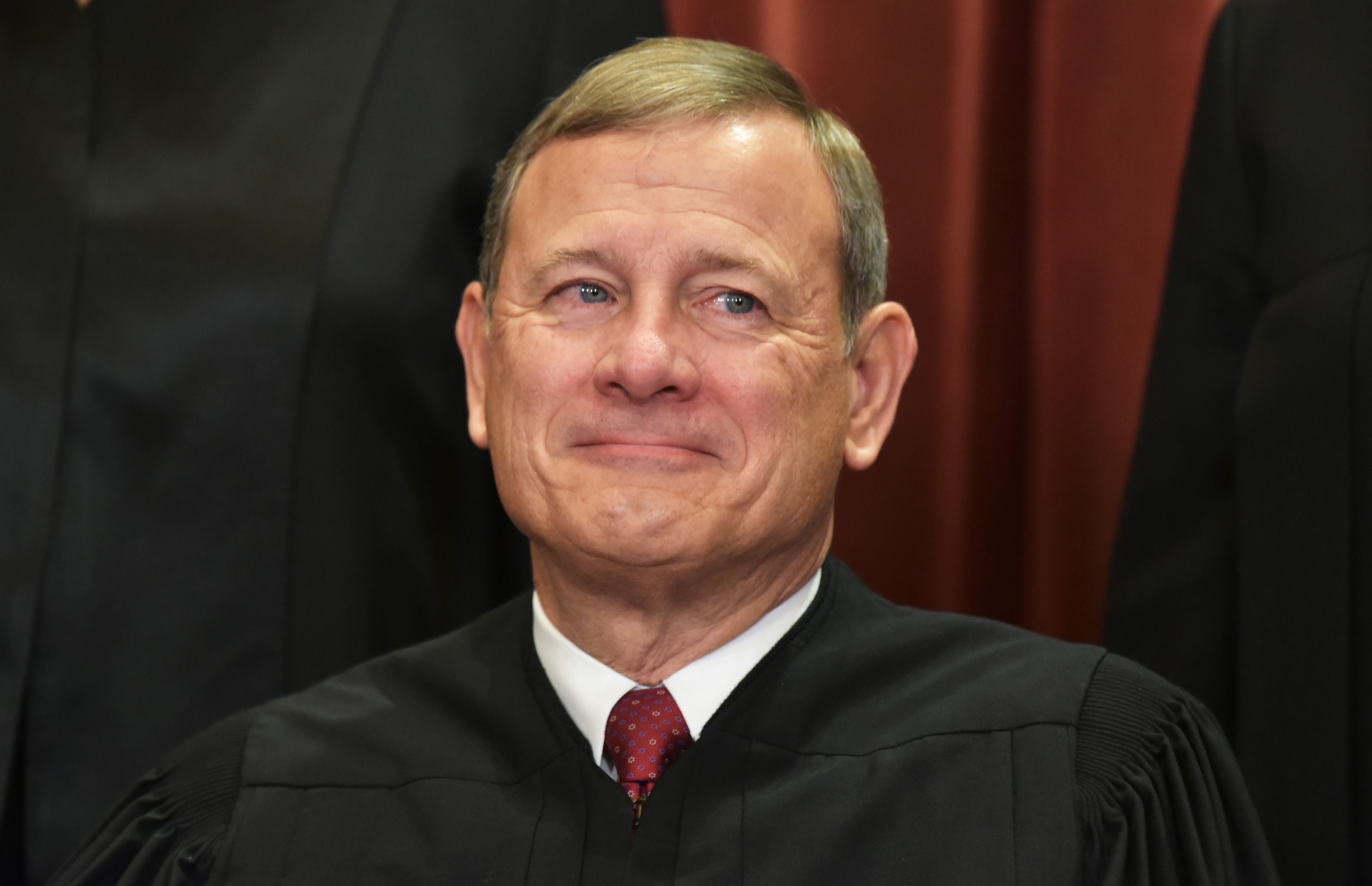 Chief Justice John Roberts poses for an official group photo at the US Supreme Court on November 30, 2018. (Mandel Ngan/AFP/Getty Images)