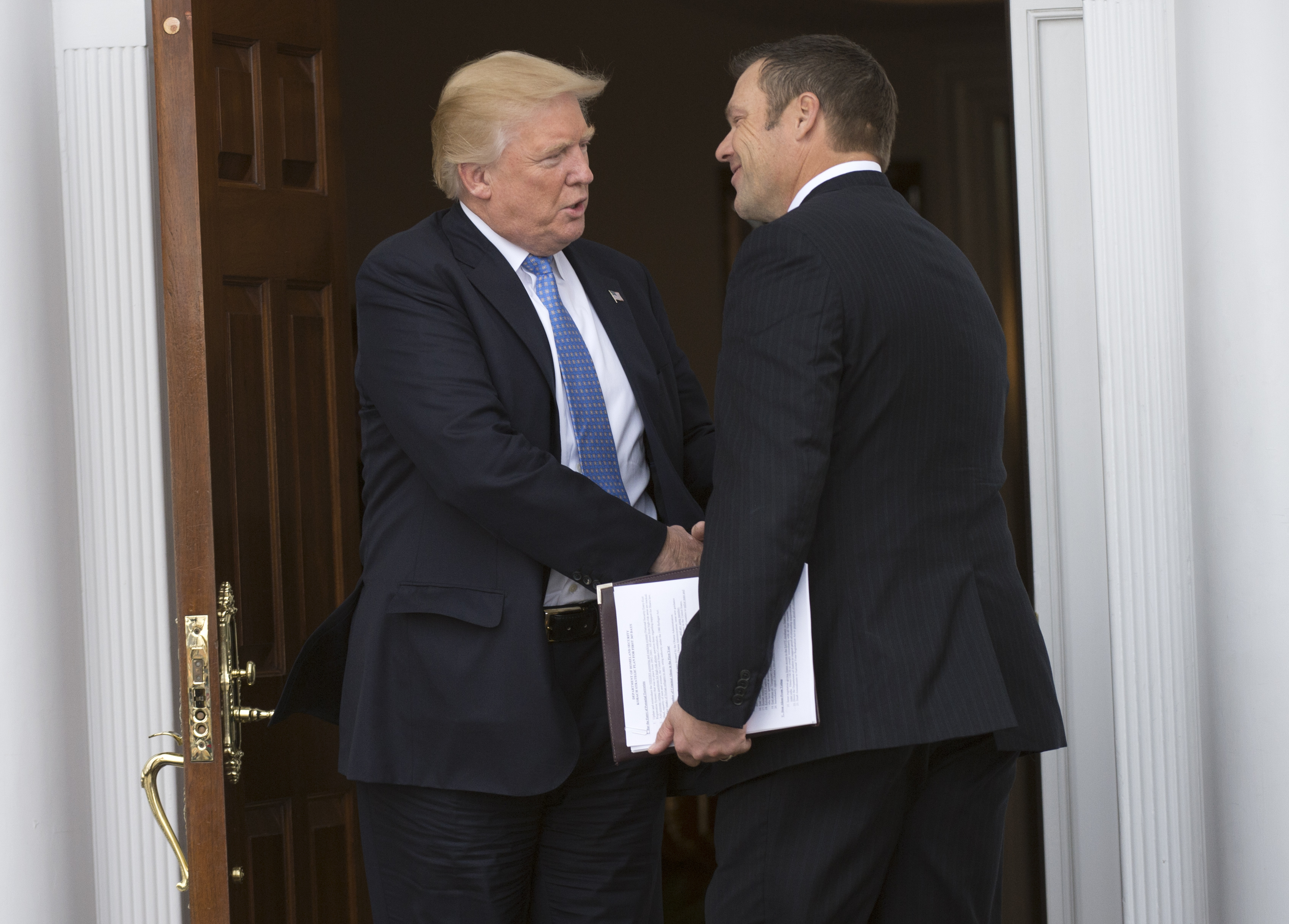 President Donald Trump meets with Kris Kobach at the Trump National Golf Club in Bedminster, New Jersey on November 20, 2016. (Don Emmert/AFP/Getty Images)