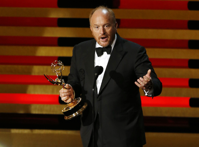 Louis C.K. accepts the Emmy award for Outstanding Writing for a Comedy Series for "Louie" onstage during the 66th Primetime Emmy Awards in Los Angeles, California August 25, 2014. REUTERS/Mario Anzuoni 