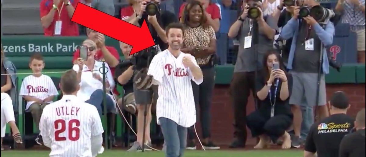 Former Philadelphia Phillies player Chase Utley throws a ceremonial first  pitch to actor Rob McElhenney, one of the creators of It's Always Sunny in  Philadelphia, before a baseball game between the Phillies