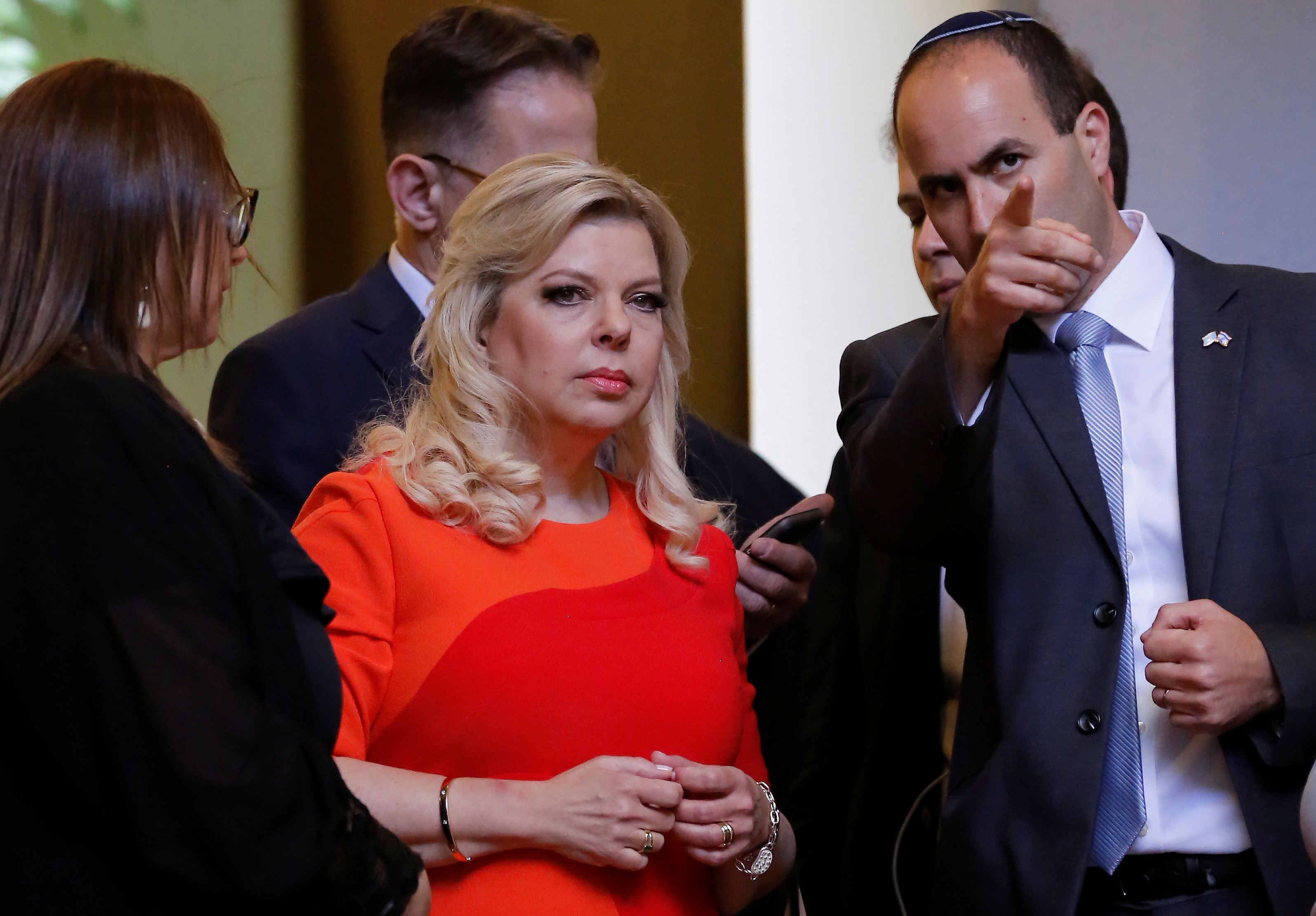 Sara Netanyahu, wife of Israeli Prime Minister Benjamin Netanyahu, listens to a member of her security staff after arriving to the National Palace in Guatemala City, Guatemala December 11, 2018. REUTERS/Luis Echeverria