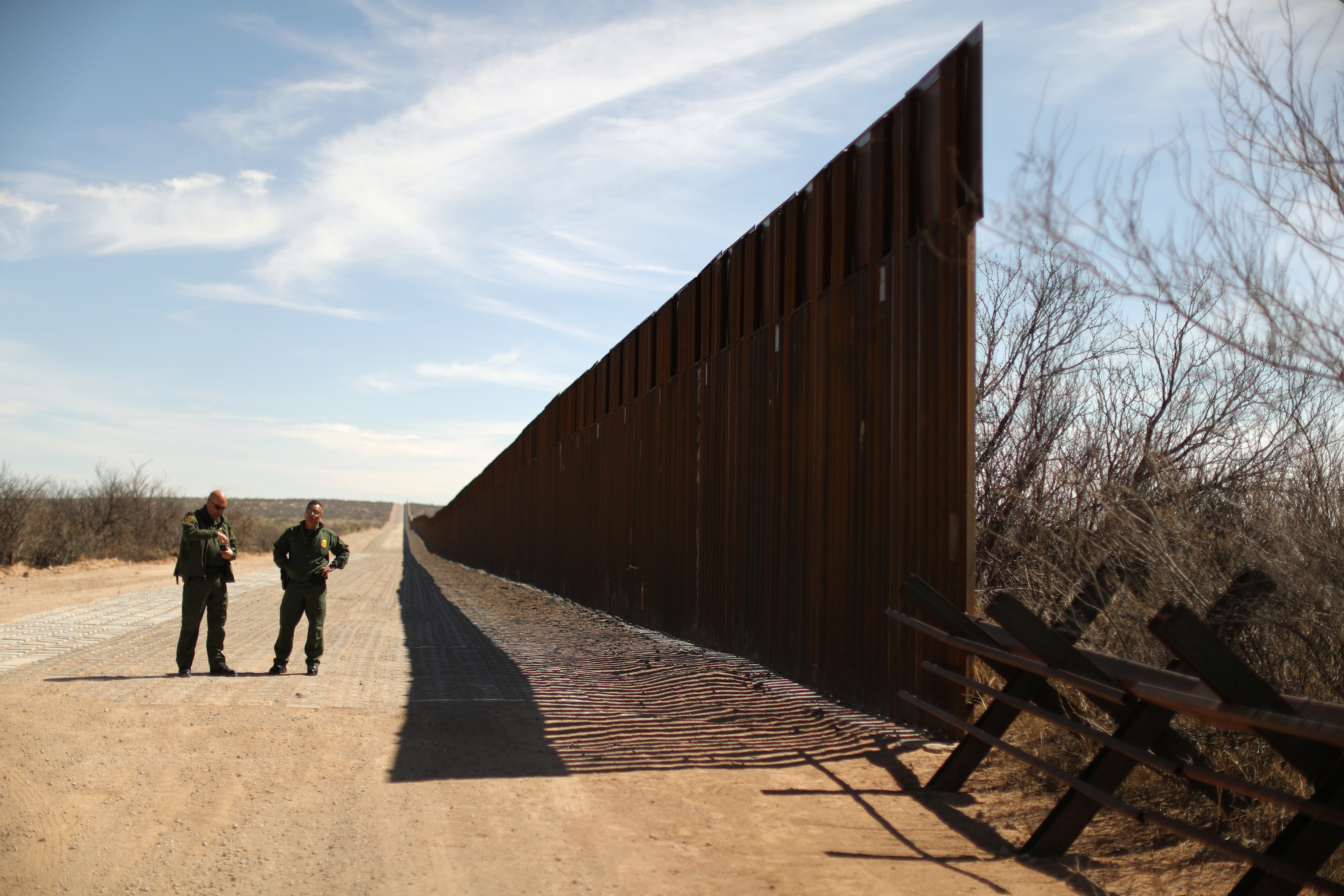 New bollard-style U.S.-Mexico border fencing is seen next to vehicle barriers in Santa Teresa