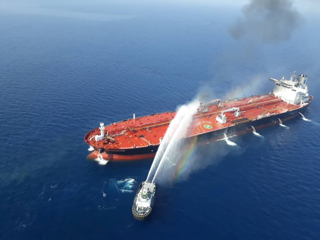 An Iranian navy boat tries to stop the fire of an oil tanker after it was attacked in the Gulf of Oman, June 13, 2019. Tasnim News Agency/Handout via REUTERS