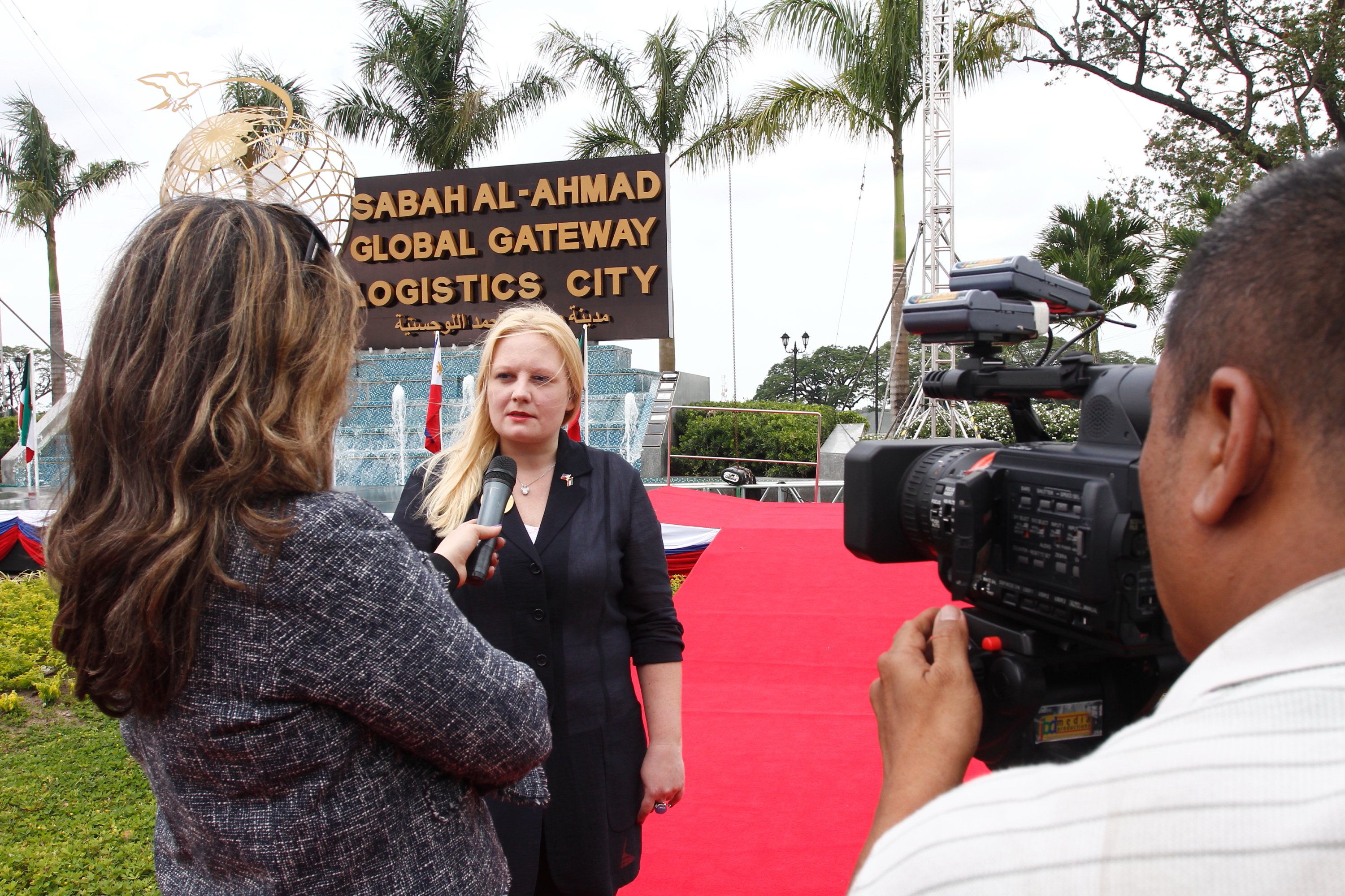 Investor Marsha Lazareva, a Russian national, is interviewed at the groundbreaking of the Sabah al Ahmad Global Gateway Logistics City in the Philippines in 2012. Courtesy KGL Investment