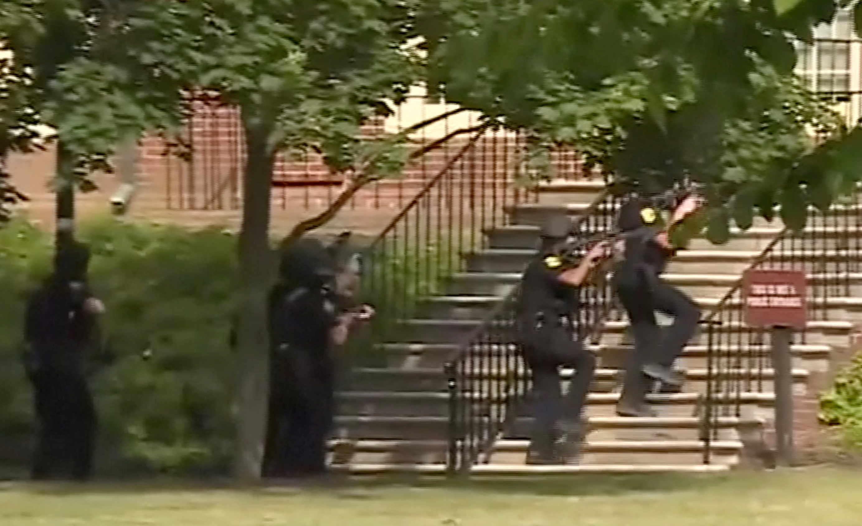 Police enter a building in this still image taken from video following a shooting incident at the municipal center in Virginia Beach, Virginia, U.S. May 31, 2019. WAVY-TV/NBC/via REUTERS