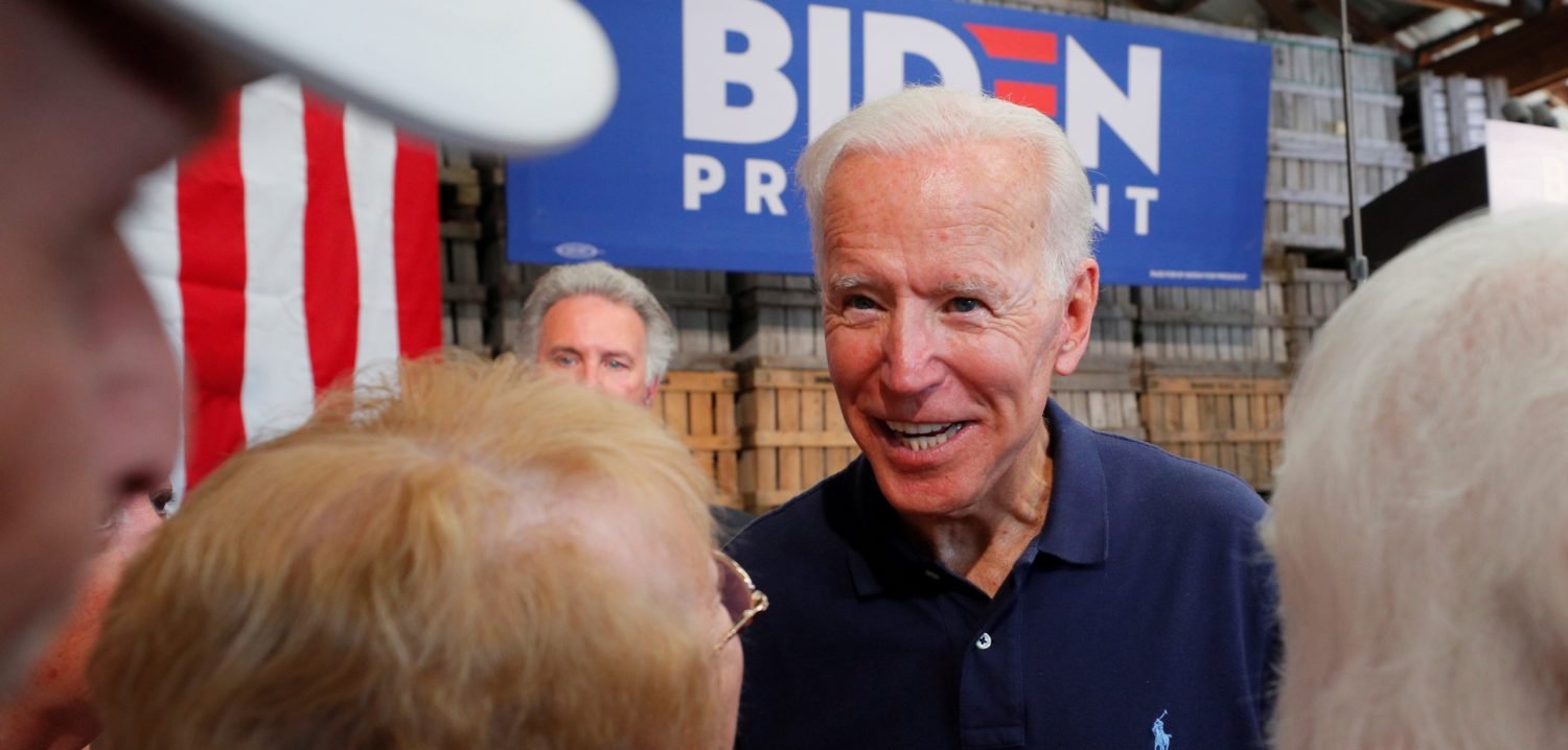 FILE PHOTO: Democratic 2020 U.S. presidential candidate and former U.S. Vice President Joe Biden greets audience members during a campaign stop at Mack's Apples in Londonderry, New Hampshire, U.S., July 13, 2019. REUTERS/Brian Snyder/File Photo