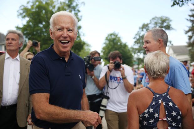 Democratic 2020 U.S. presidential candidate and former Vice President Joe Biden greets supporters at the Independence Day parade in Independence, Iowa