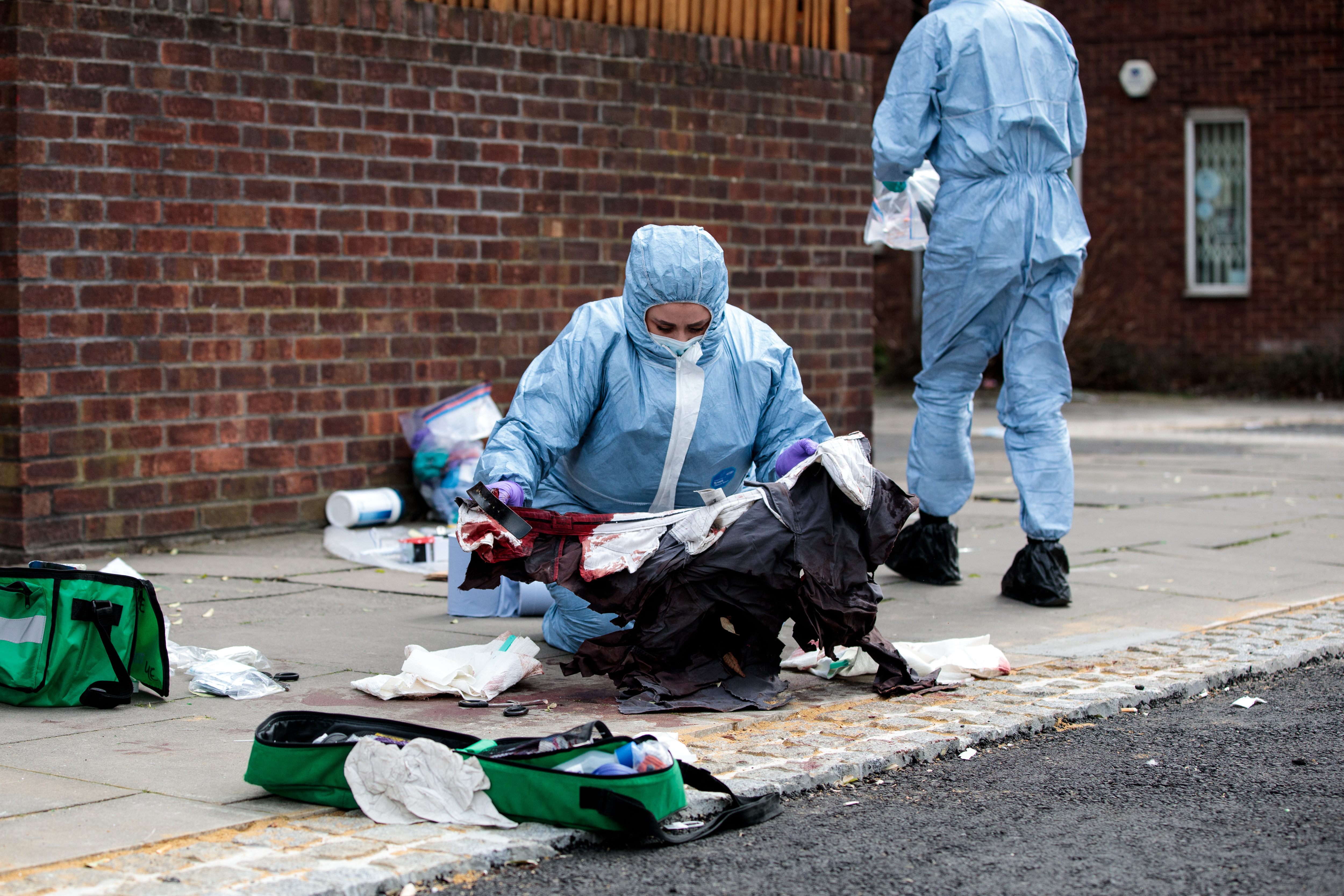 LONDON, ENGLAND - MARCH 31: Forensics teams work at the scene of a stabbing in Edmonton on March 31, 2019 in London, England. Four people have been stabbed in a spate of knife attacks in North London over the weekend. (Photo by Jack Taylor/Getty Images)