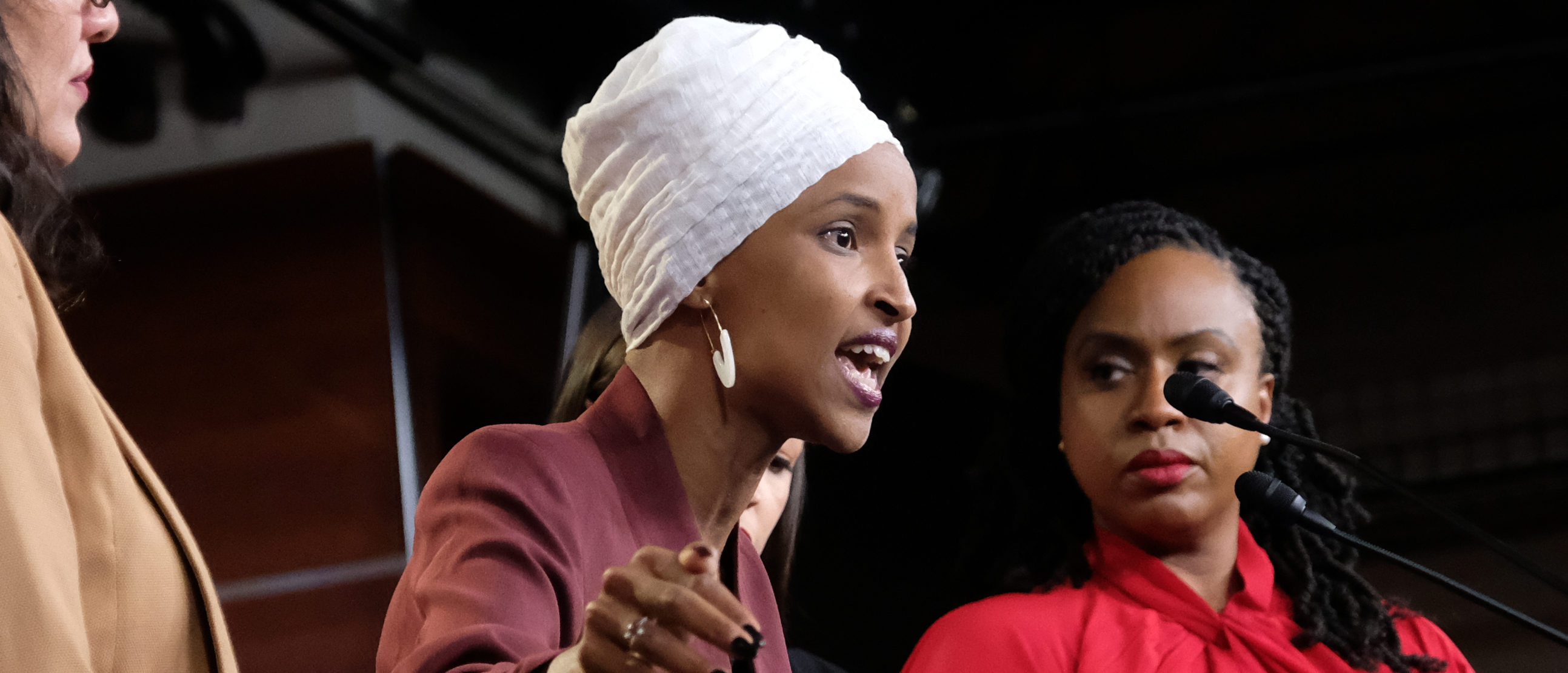 Ilhan Omar speaks as Reps. Ayanna Pressley and Rashida Tlaib listen during a news conference at the US Capitol on July 15, 2019 in Washington, D.C. (Photo by Alex Wroblewski/Getty Images)