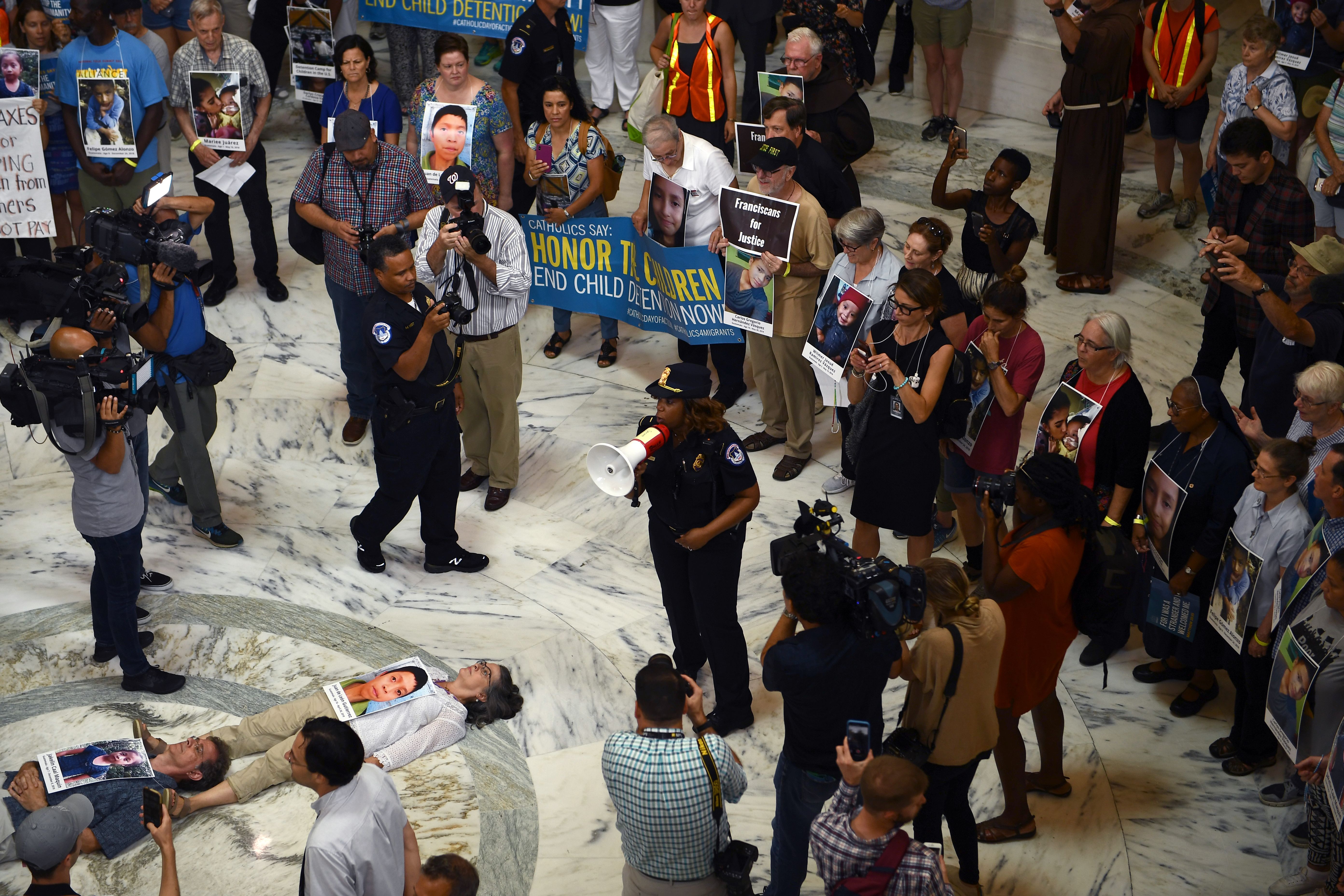 Members of the Franciscan Action Network holds a prayer vigil to "end the abuse and detention of children at the Russell Senate Office Building on Capitol Hill in Washington, DC, on July 18, 2019. (Photo by Brendan Smialowski / AFP) (Photo credit should read BRENDAN SMIALOWSKI/AFP/Getty Images)