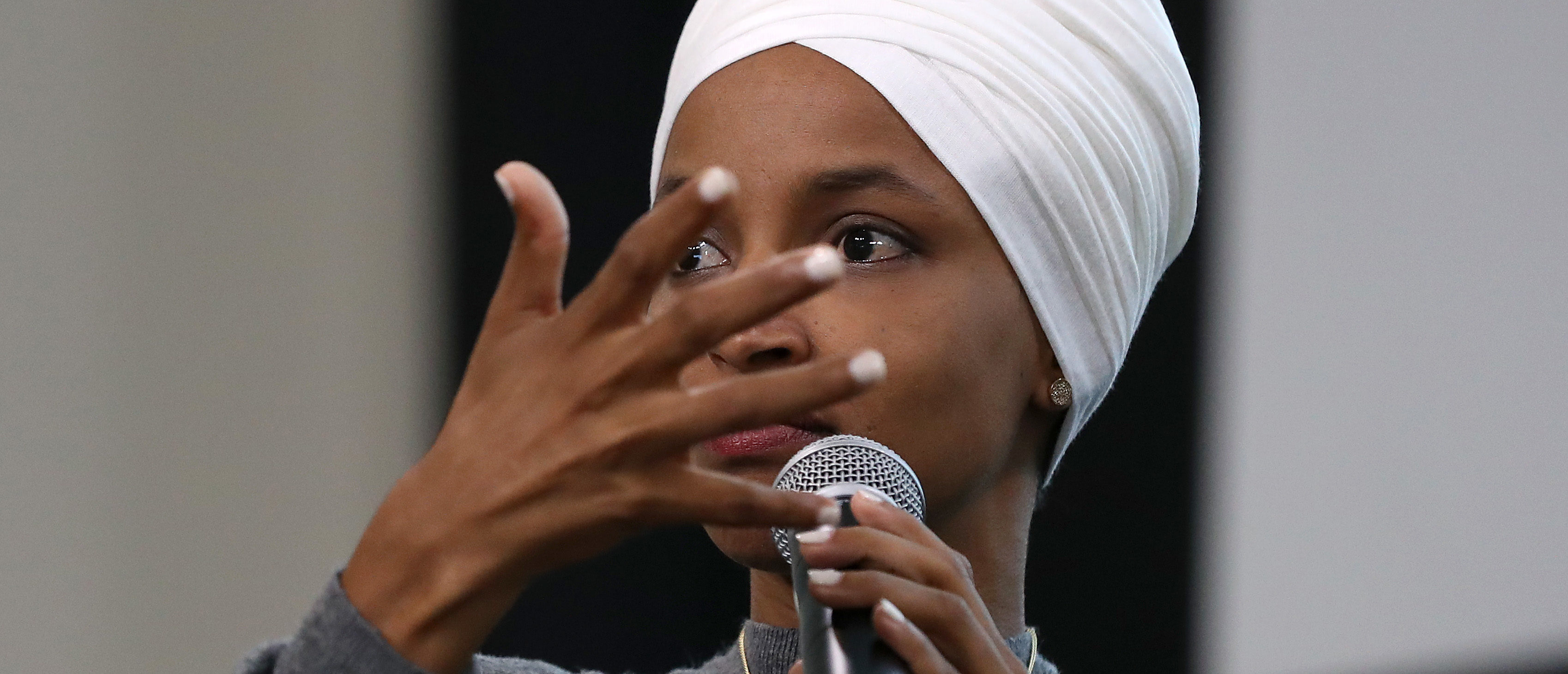 WASHINGTON, DC - JULY 23: Rep. Ilhan Omar (D-MN) participates in a panel discussion during the Muslim Collective For Equitable Democracy Conference and Presidential Forum at the The National Housing Center July 23, 2019 in Washington, DC. As a member of a group of four freshman Democratic women of color, known informally as 'The Squad,' Omar has been targeted by President Donald Trump with controversial tweets during the last week. (Photo by Chip Somodevilla/Getty Images)