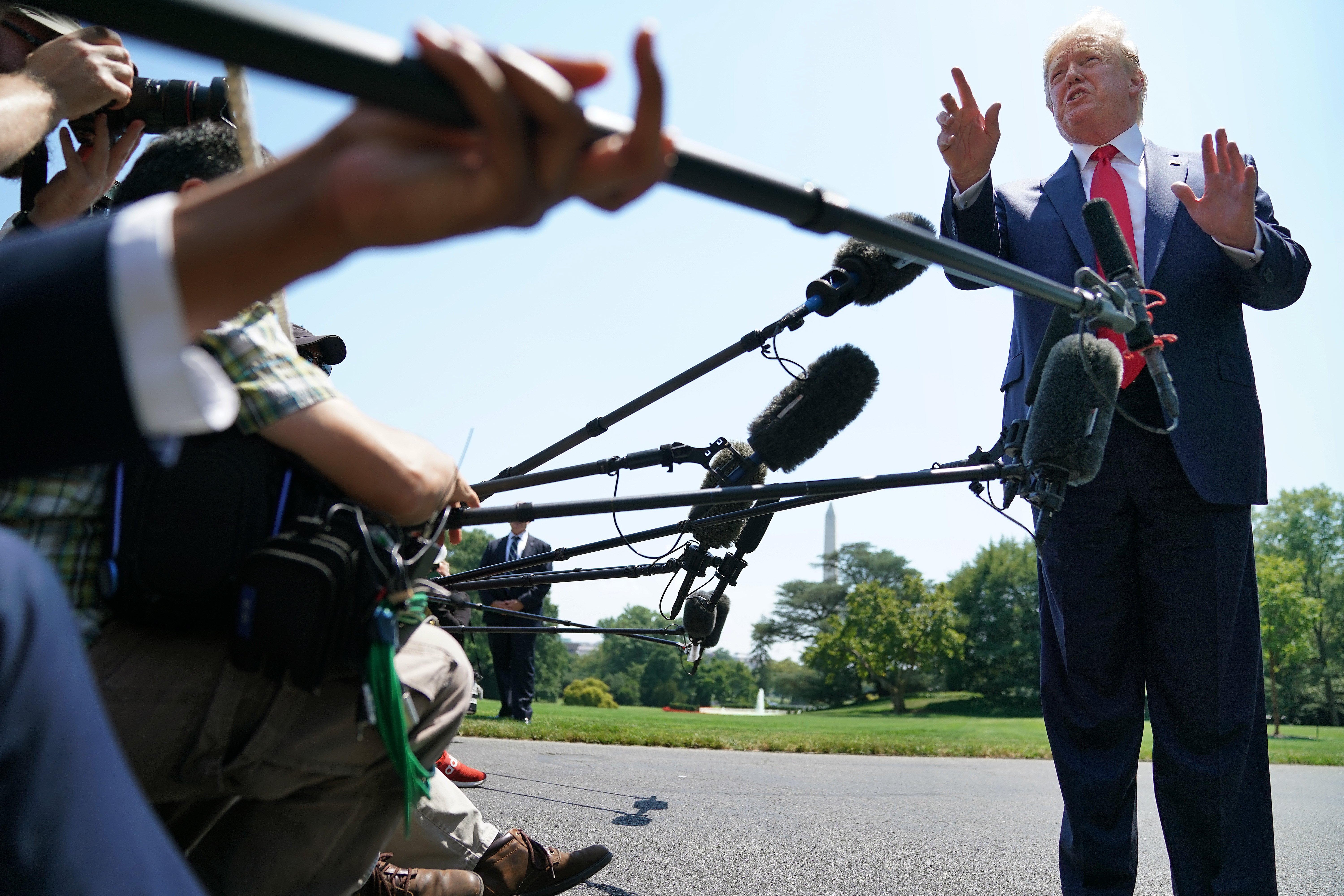WASHINGTON, DC - JULY 30: U.S. President Donald Trump talks to journalists after returning to the White House July 30, 2019 in Washington, DC. Trump traveled to Williamsburg, Virginia, to deliver remarks at the 400th Anniversary of the first representative legislative assembly at the historic Jamestown settlement. (Photo by Chip Somodevilla/Getty Images)