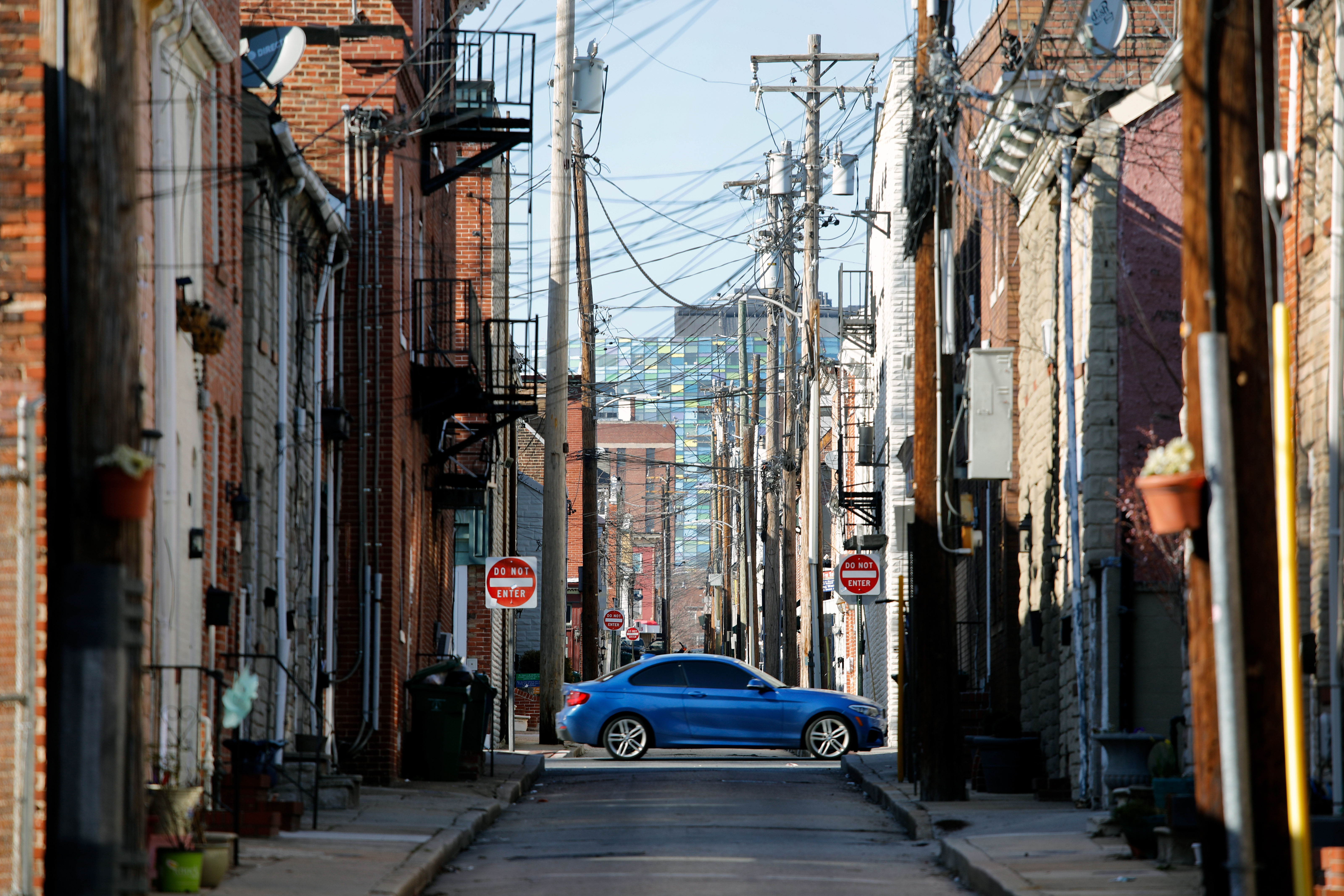 A car drives down a street in Baltimore, MD on March 26, 2018. (Photo by David GANNON /Getty Images)