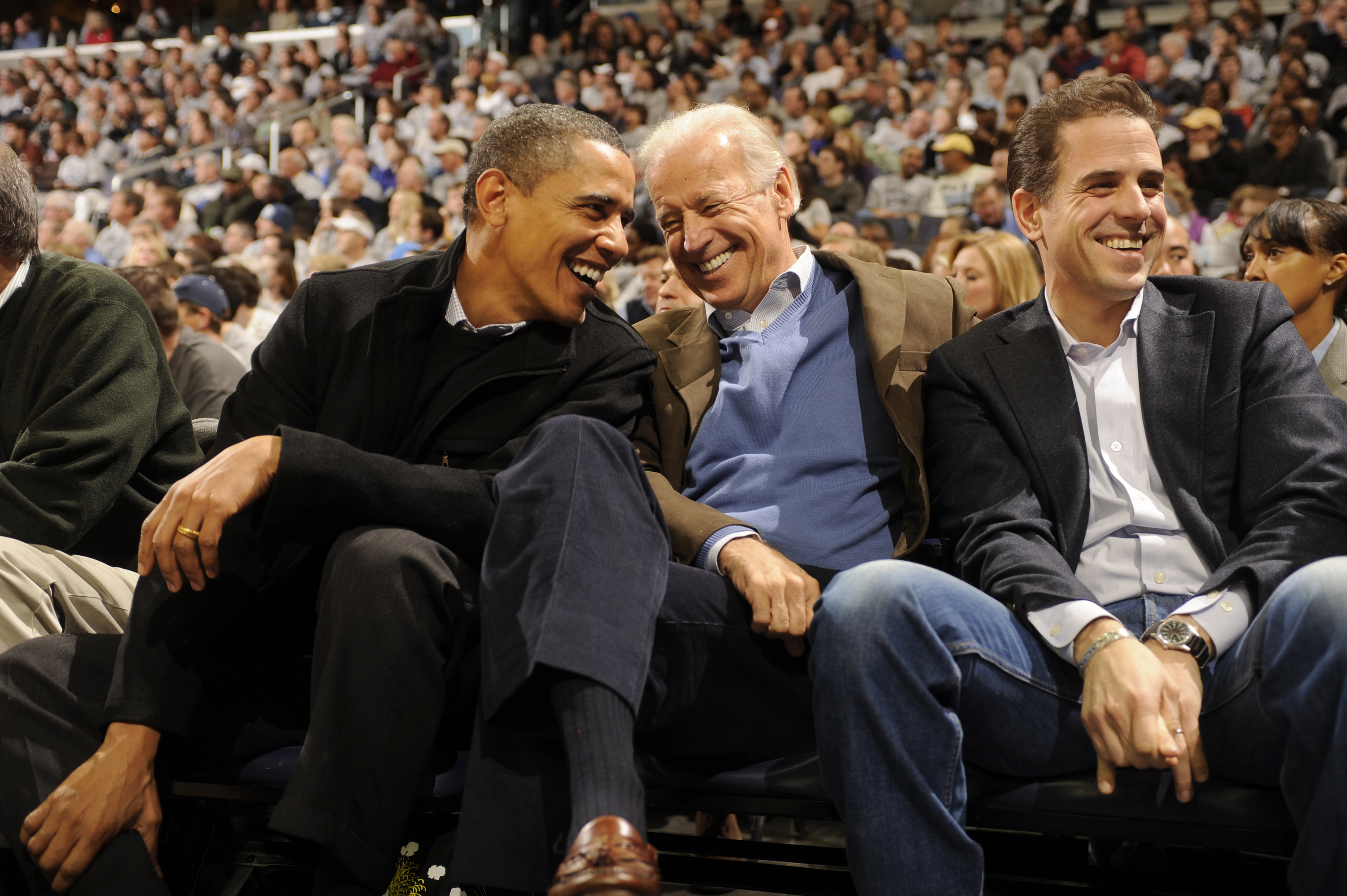 WASHINGTON - JANUARY 30: President of the United States Barack Obama and Vice President Joe Biden and Hunter Biden (son of Joe Biden) talk during a college basketball game between Georgetown Hoyas and the Duke Blue Devils on January 30, 2010 at the Verizon Center in Washington DC. (Photo by Mitchell Layton/Getty Images)