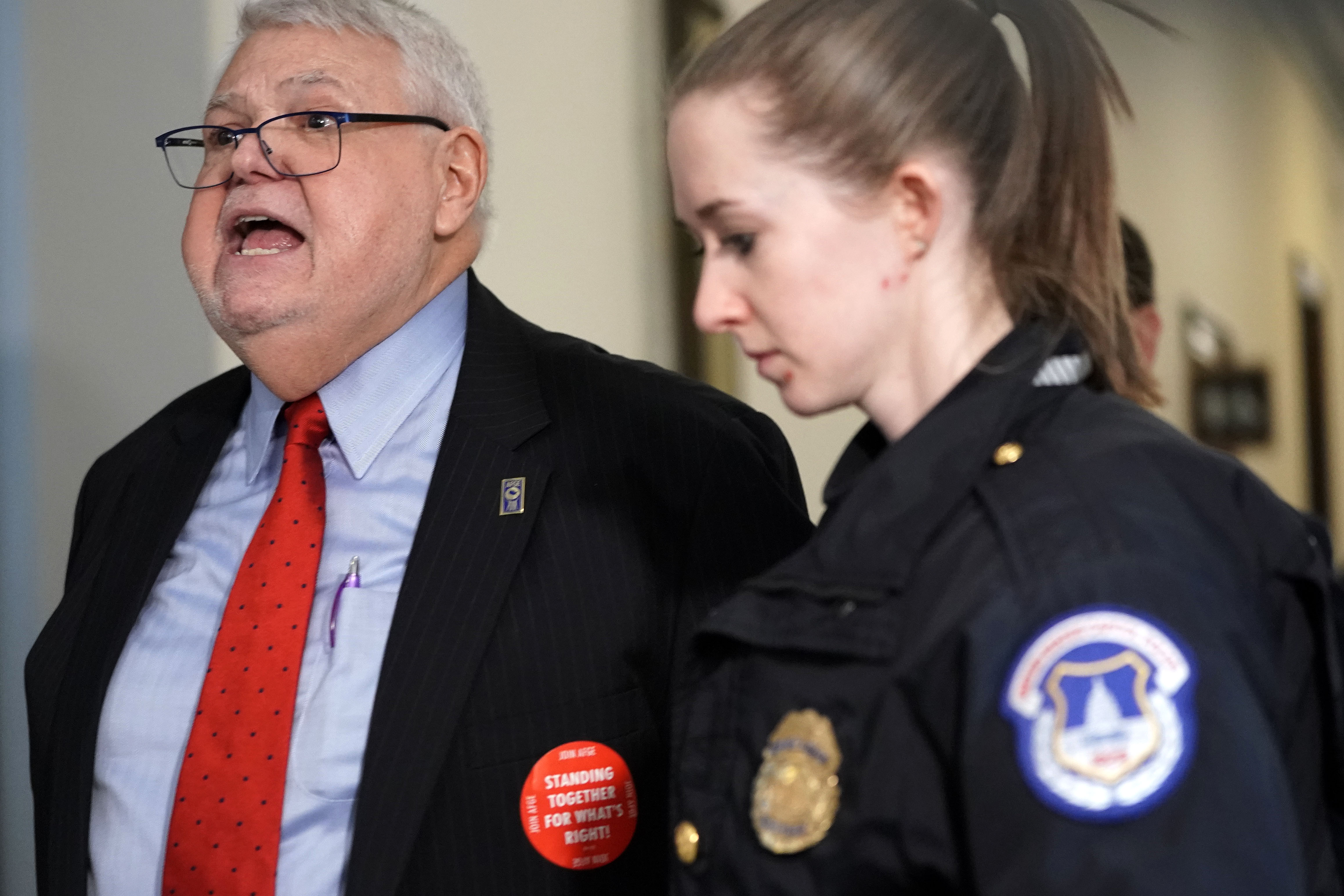 J. David Cox, president of the American Federation of Government Employees (AFGE), is led away by a member of U.S. Capitol Police while protesting the government shutdown on January 23, 2019. (Alex Wong/Getty Images)