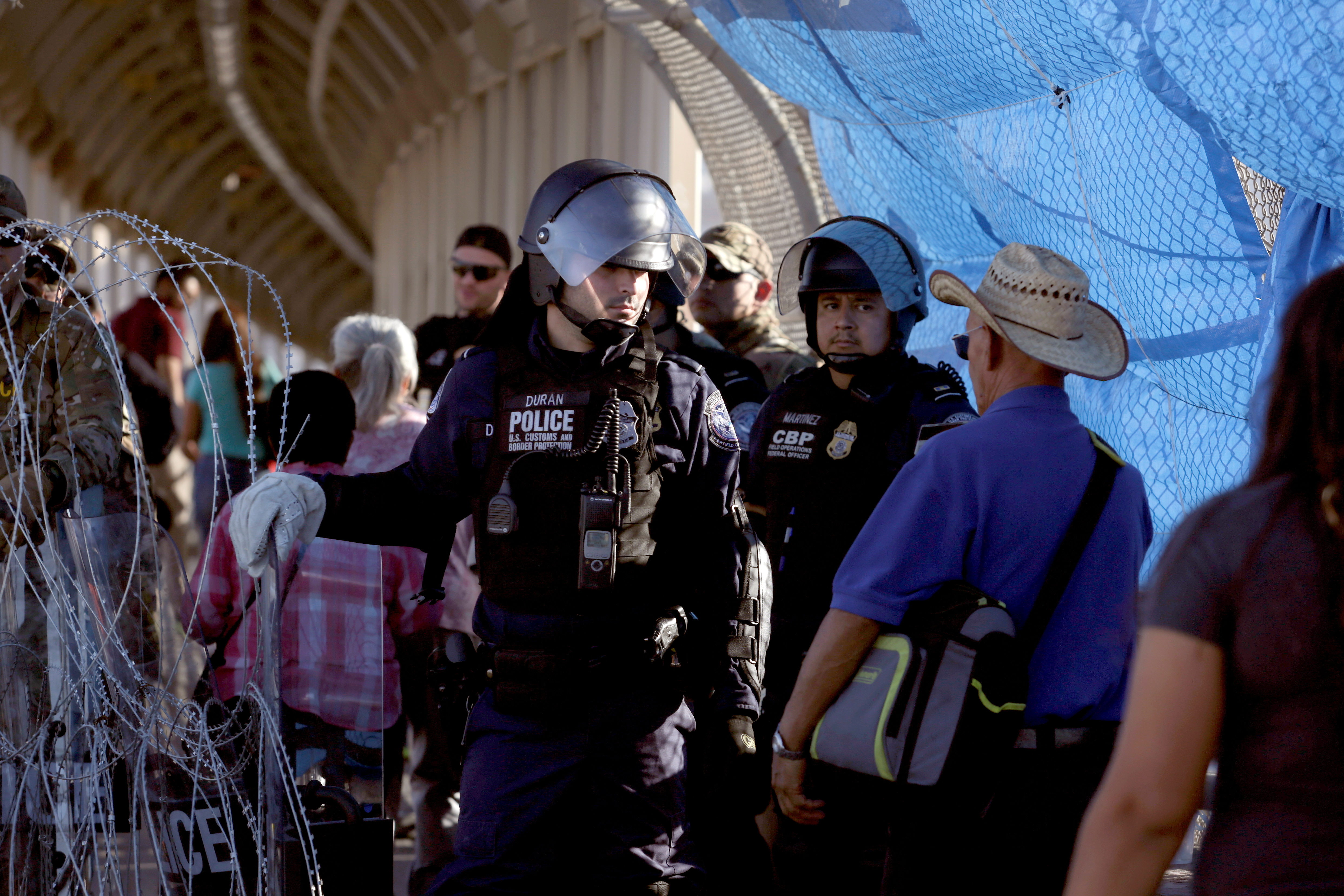 A CBP police member is seen at Paso del Norte border crossing bridge, as seen from Ciudad Juarez