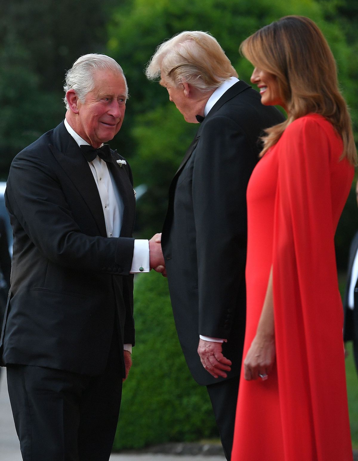 US President Donald Trump (C) and US First Lady Melania Trump (R) greet Britain's Prince Charles, Prince of Wales ahead of a dinner at Winfield House, the residence of the US Ambassador, where US President Trump is staying whilst in London, on June 4, 2019... (Photo credit: MANDEL NGAN/AFP/Getty Images)