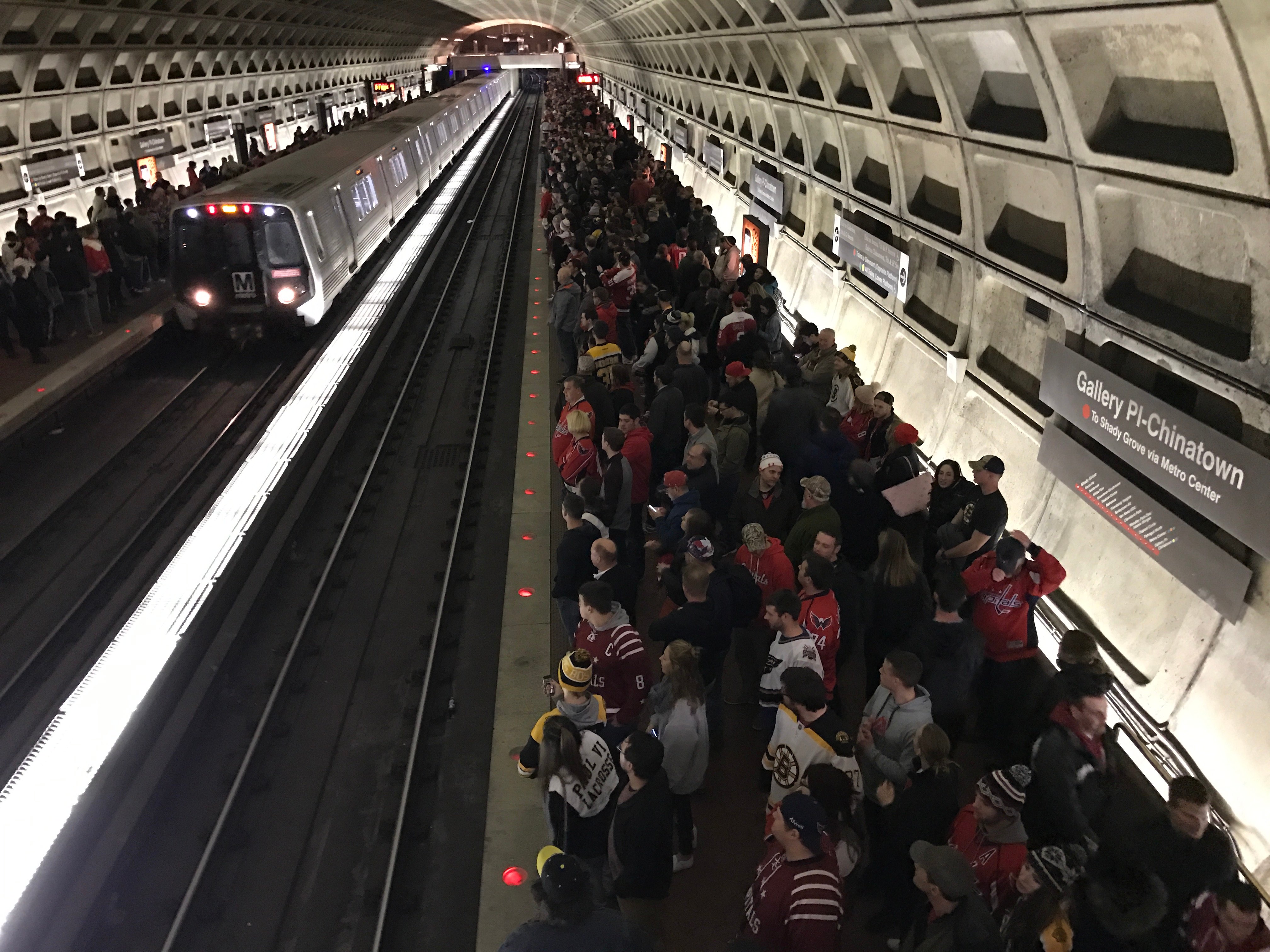 Hockey fans of the Washington Capitals team wait for a metro on February 1st, 2017 after a game at the Verizon center stadium. The Washington Metro, known colloquially as Metro and branded Metrorail, is the heavy rail rapid transit system serving the Washington, D.C. metropolitan area in the United States. It is administered by the Washington Metropolitan Area Transit Authority (WMATA), which also operates Metrobus service under the Metro name.Besides the District, Metro serves several jurisdictions in Maryland and Virginia. (DANIEL SLIM/AFP/Getty Images)