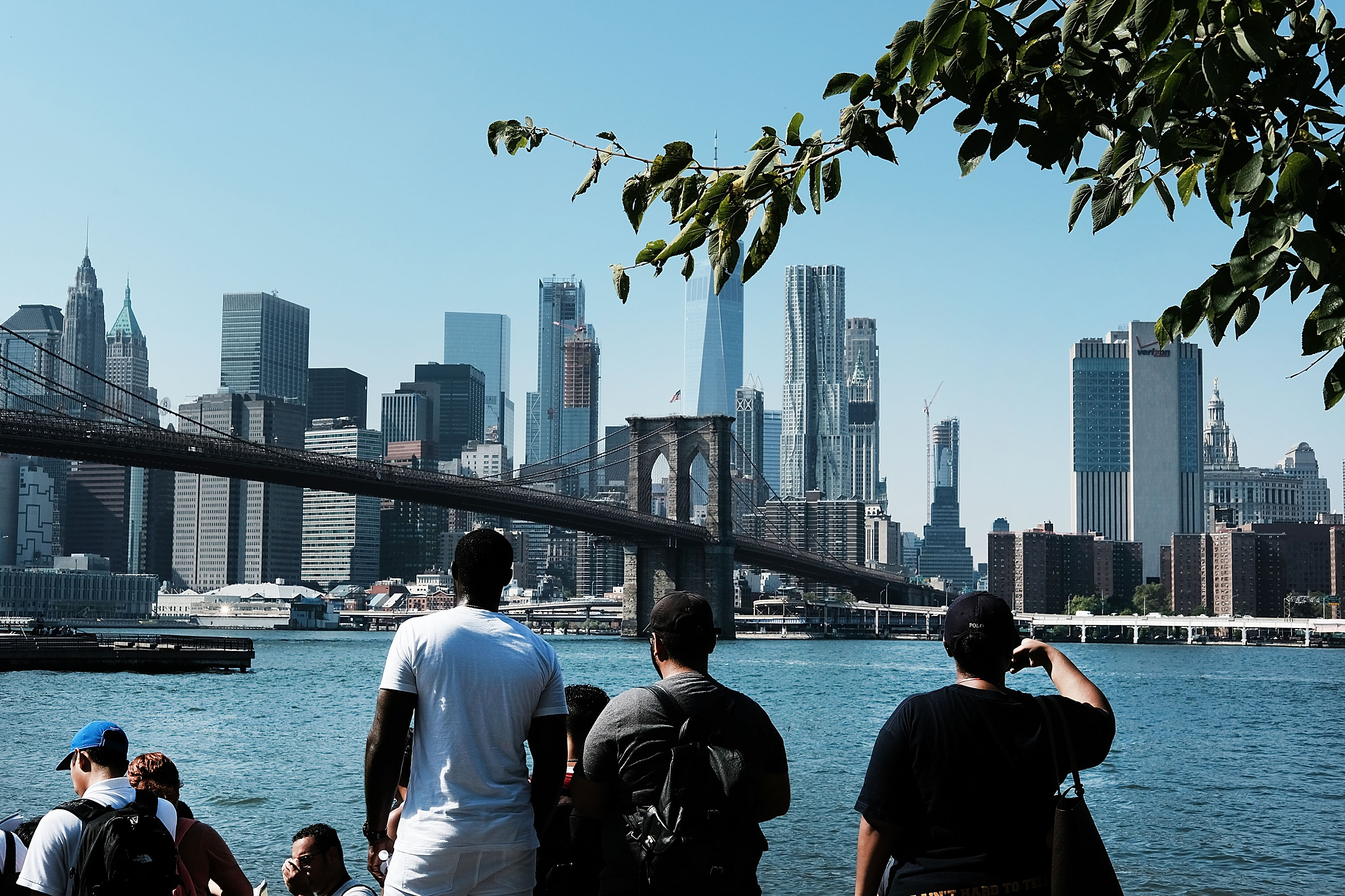People look out at the East River on an unseasonably warm afternoon on September 25, 2017 in New York City. Despite officially entering fall last week, New York City and much of the East Coast has experienced unseasonably warm weather over the past few days. (Photo by Spencer Platt/Getty Images)