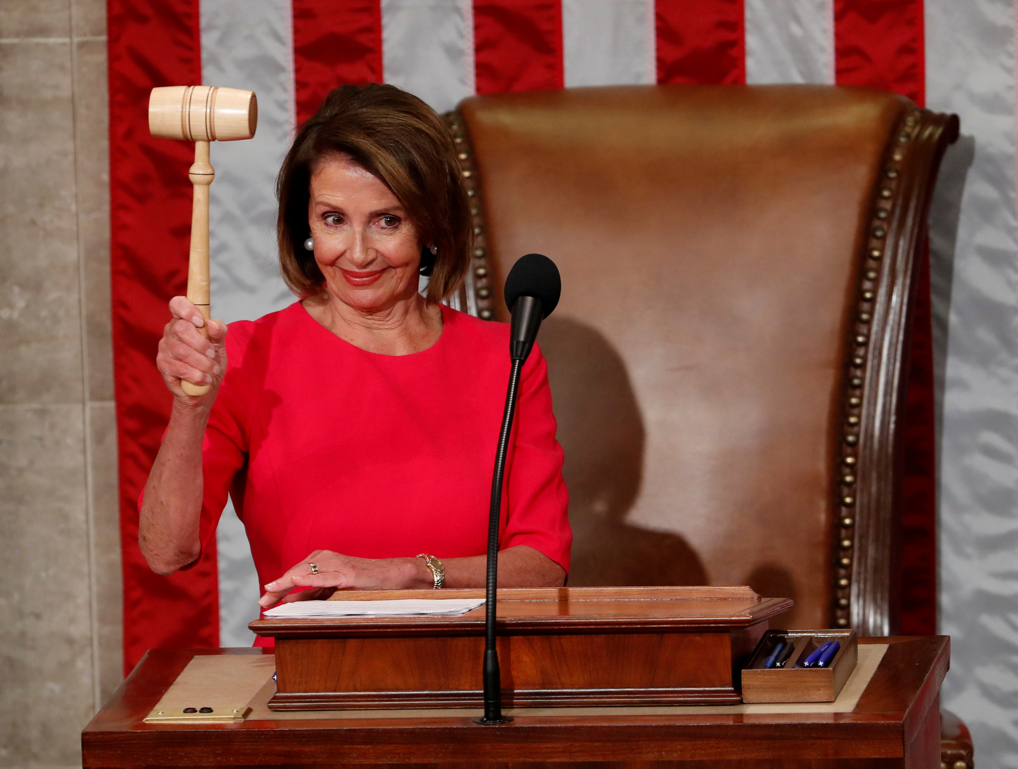 House Speaker-delegate Nancy Pelosi (D-CA) raises the gavel after being elected as House Speaker in Washington