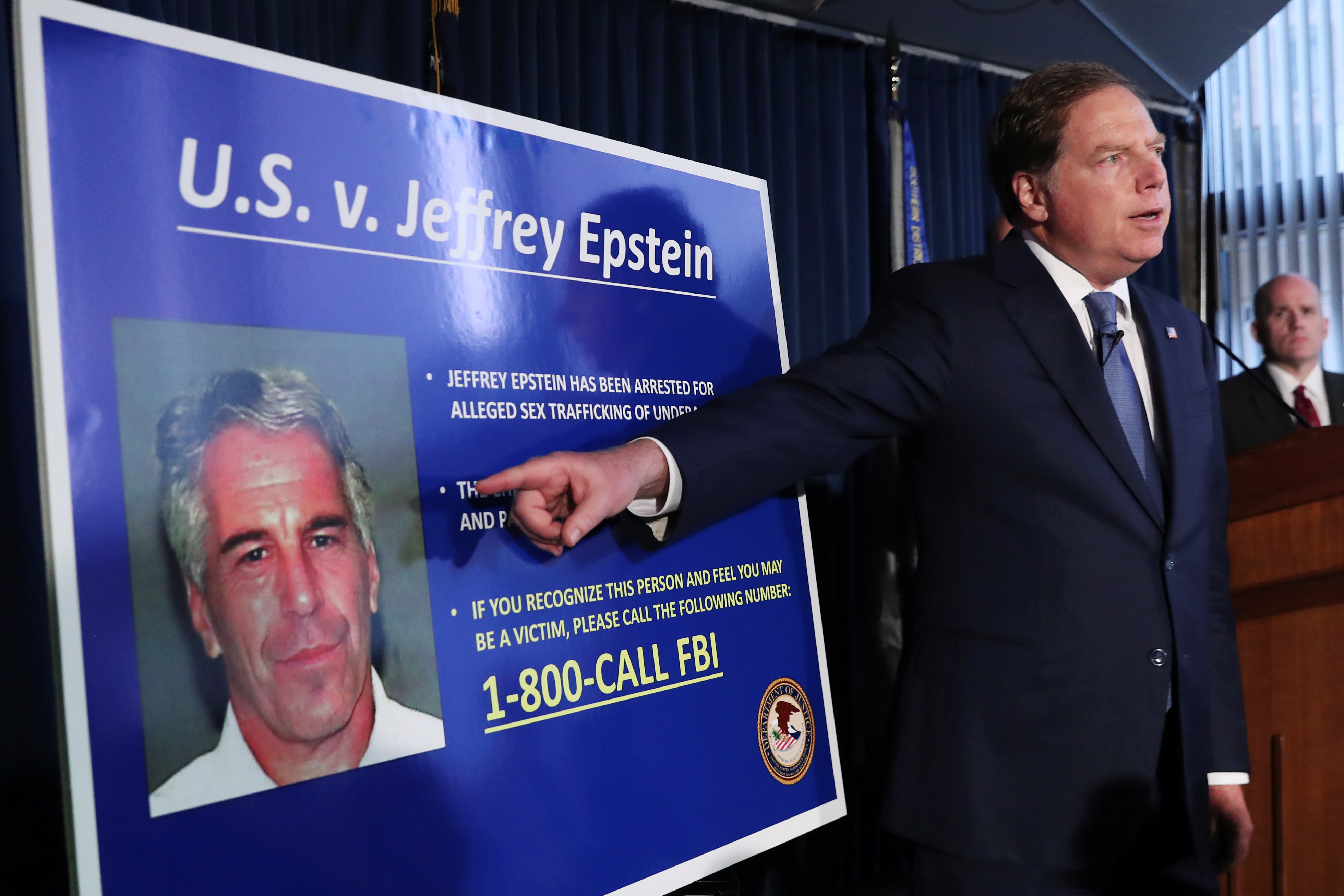 Geoffrey Berman, United States Attorney for the Southern District of New York, points to a photograph of Jeffrey Epstein as he announces the financier's charges of sex trafficking of minors and conspiracy to commit sex trafficking of minors, in New York, U.S., July 8, 2019. REUTERS/Shannon Stapleton