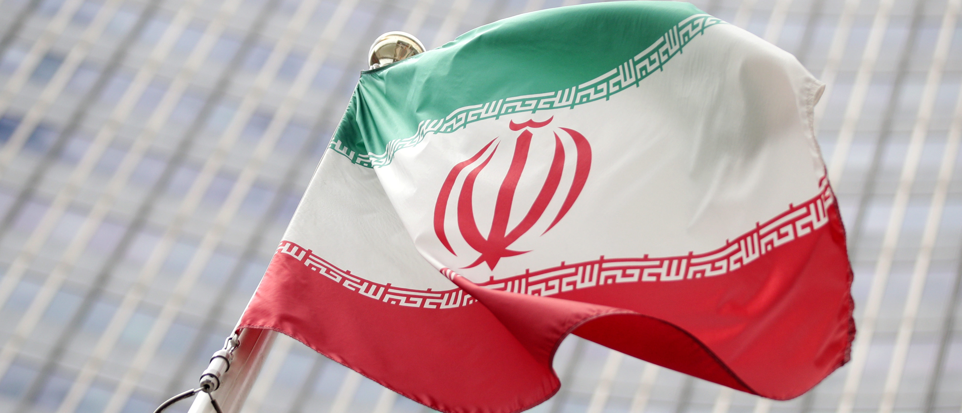The Iranian flag flutters in front the International Atomic Energy Agency (IAEA) headquarters in Vienna, Austria July 10, 2019. REUTERS/Lisi Niesner