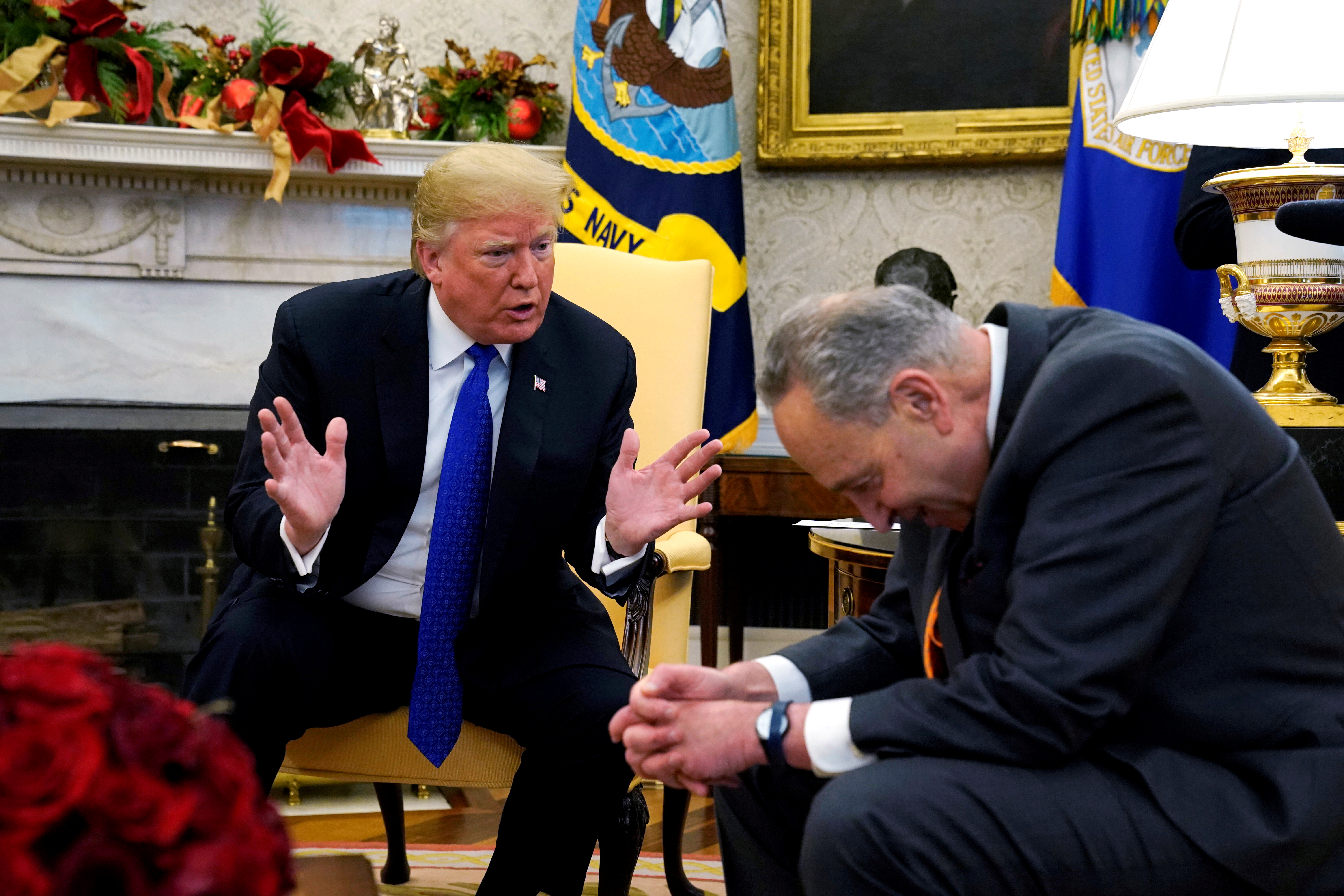 U.S. President Donald Trump speaks with Senate Democratic Leader Chuck Schumer in the Oval Office of the White House in Washington, U.S., December 11, 2018. REUTERS/Kevin Lamarque
